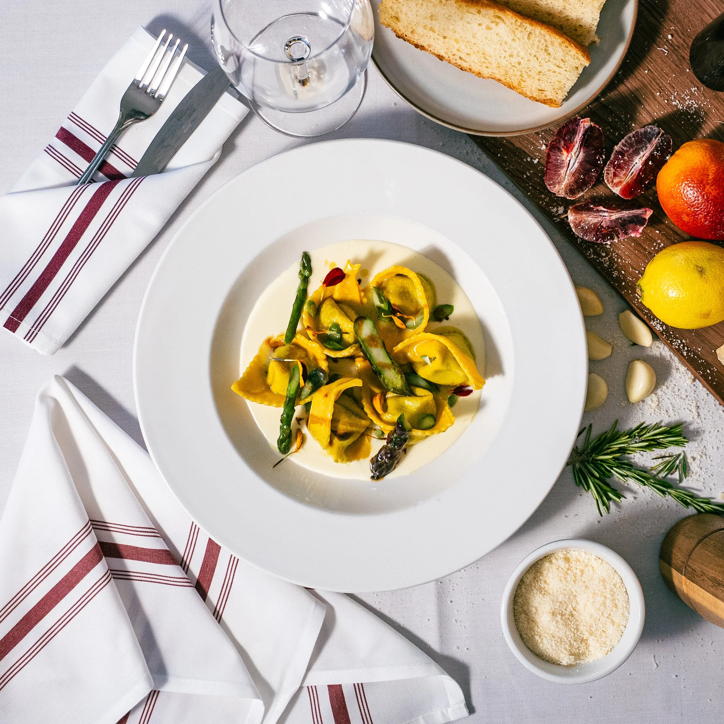 Giant Tortellini, stuffed with taleggio cheese, spring asparagus. Served with a lemon crema, and aged balsamic.