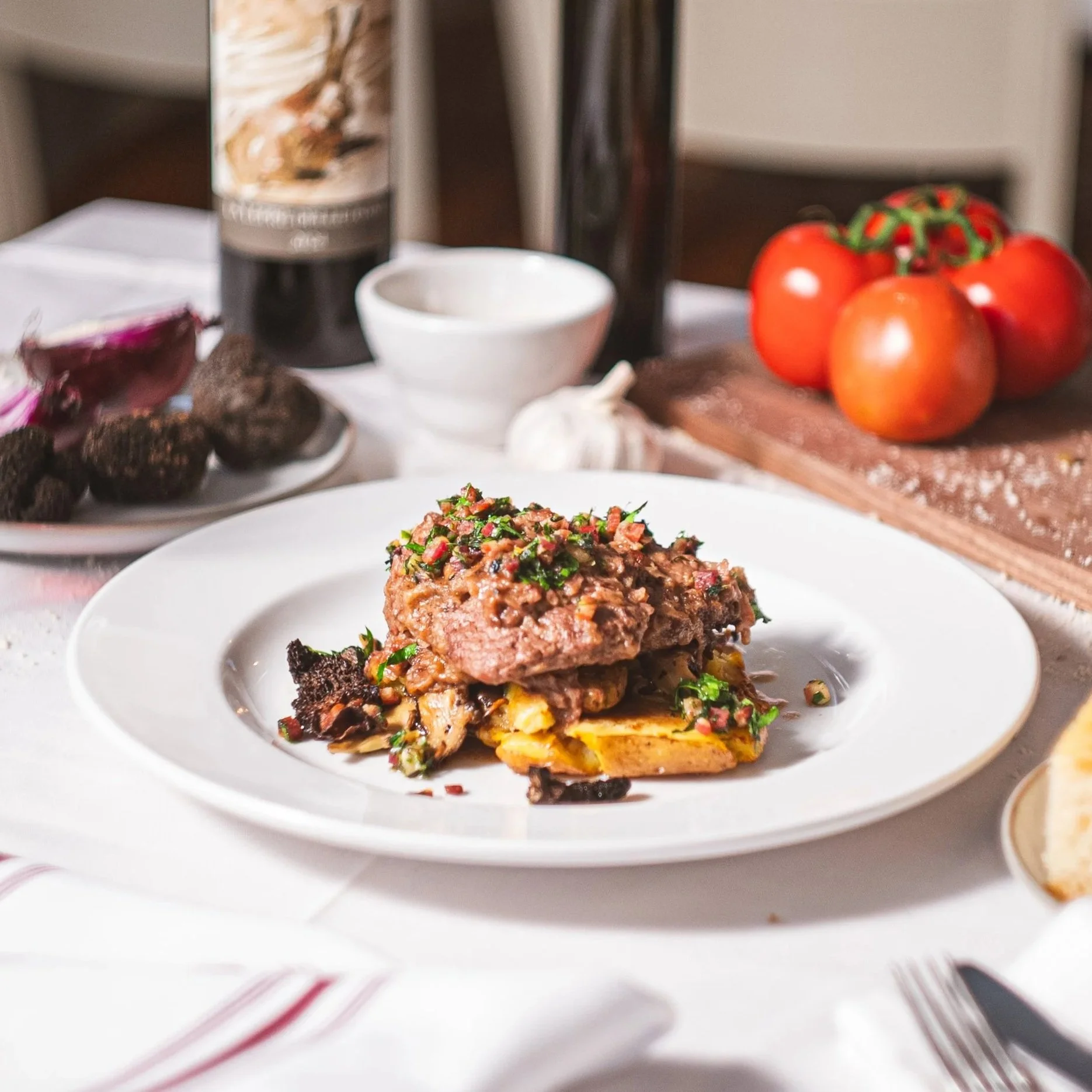 Veal scallopine, served with foraged mushrooms, pancetta gremolata, and crushed potatoes