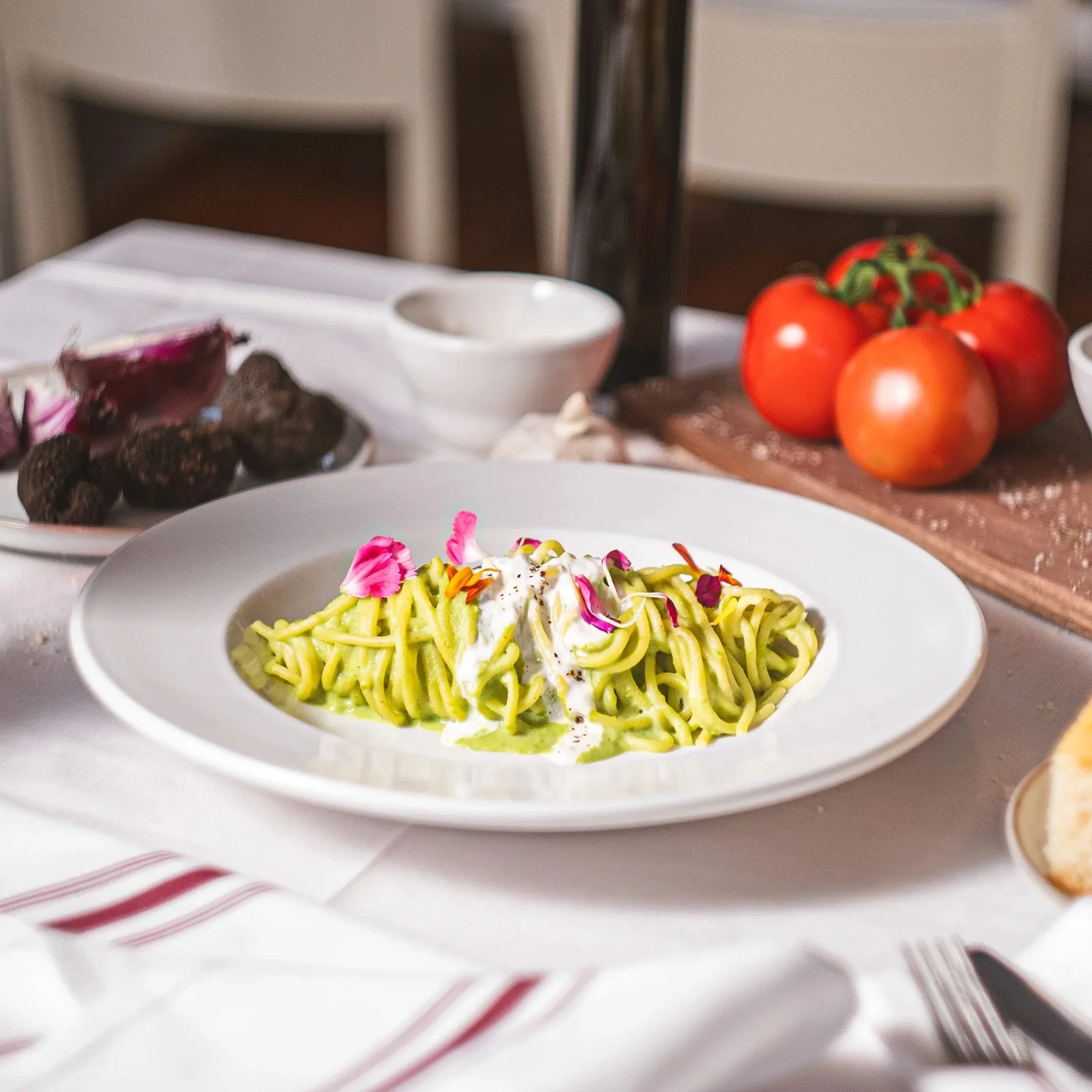 House made Spaghetti with burrata cream, spring peas, mint and preserved lemon