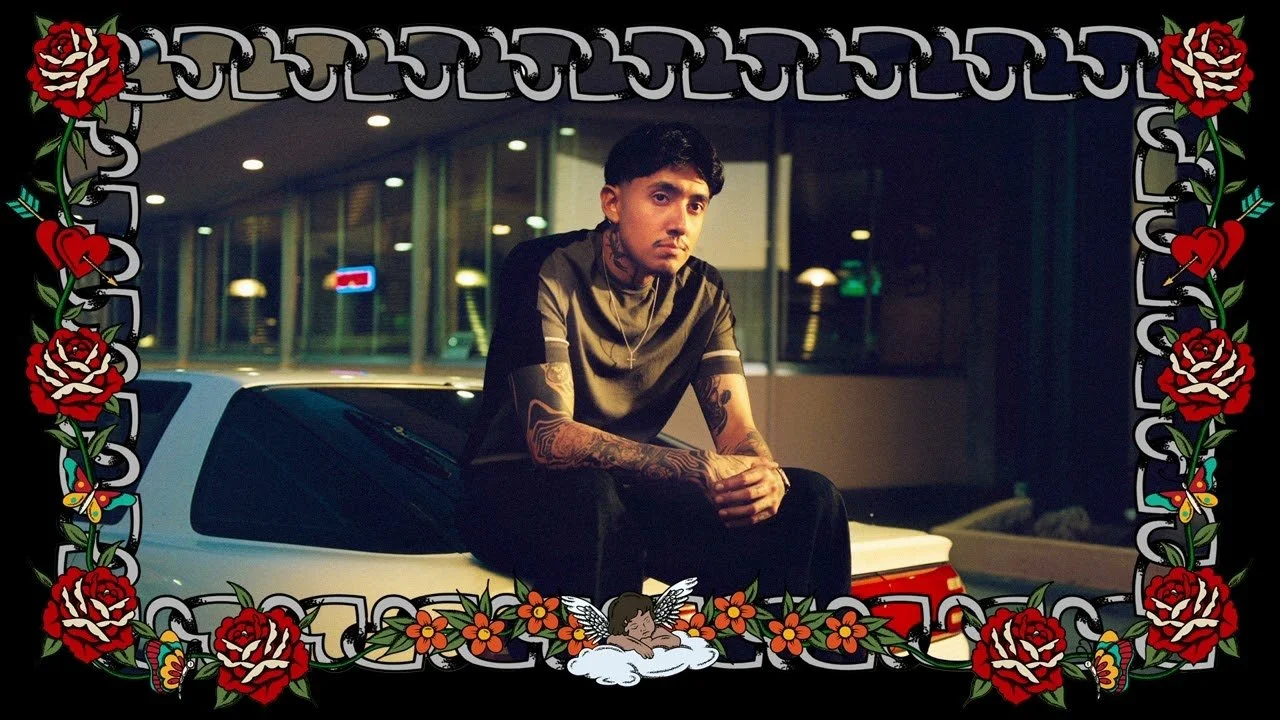 Cuco singer A young man with tattoos sitting on the hood of a car at night in a parking lot, with a decorative floral border around the image.