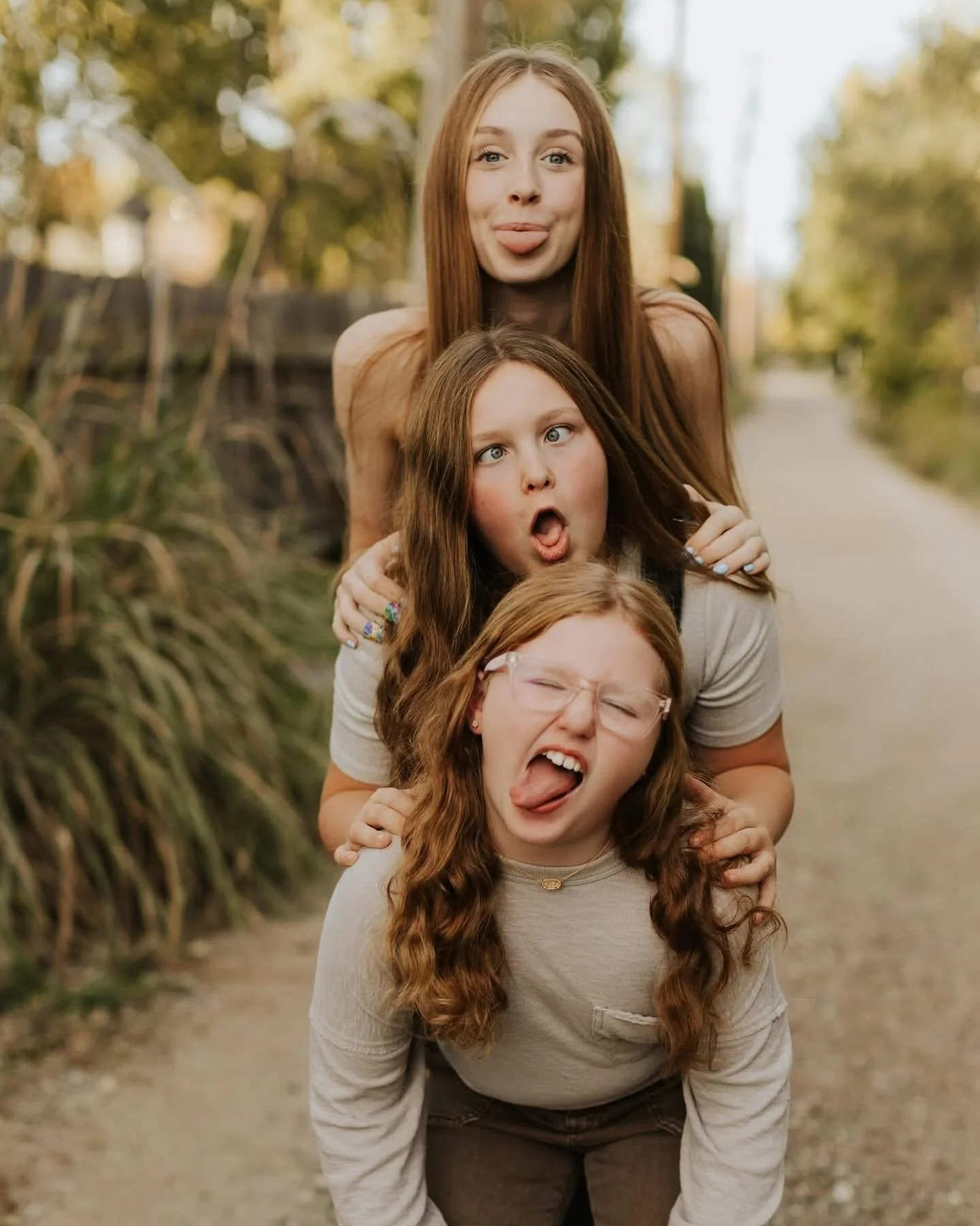 My girls dislike getting their photos done just as much as your kids do. But over the years they have learned that the better they cooperate, the less time it takes. 
Some sessions they are enthusiastic, full of ideas, and others it takes all I can d