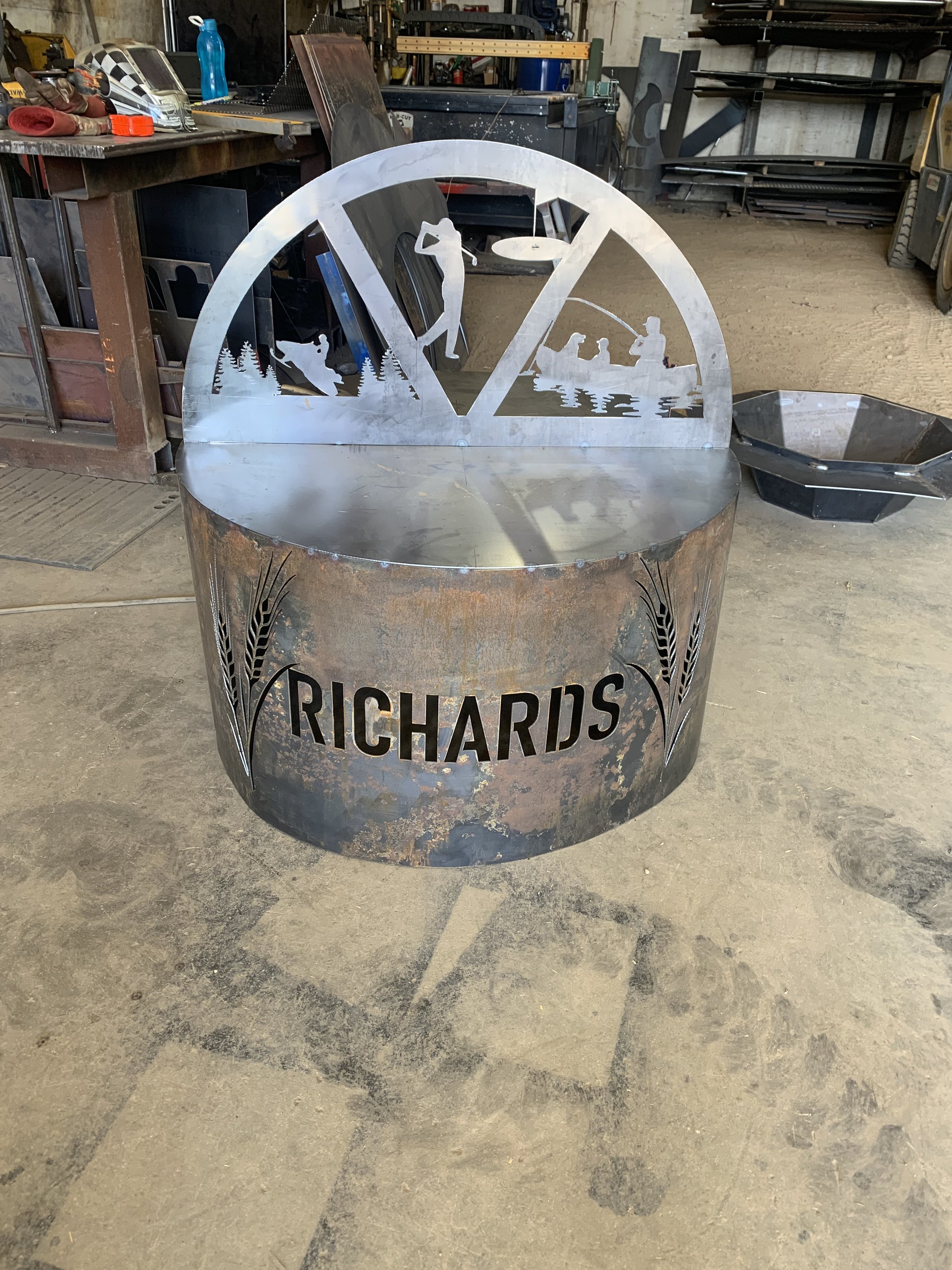 Unique outdoor firepit featuring personalized design, plasma-cut for precision and built to withstand Canadian winters