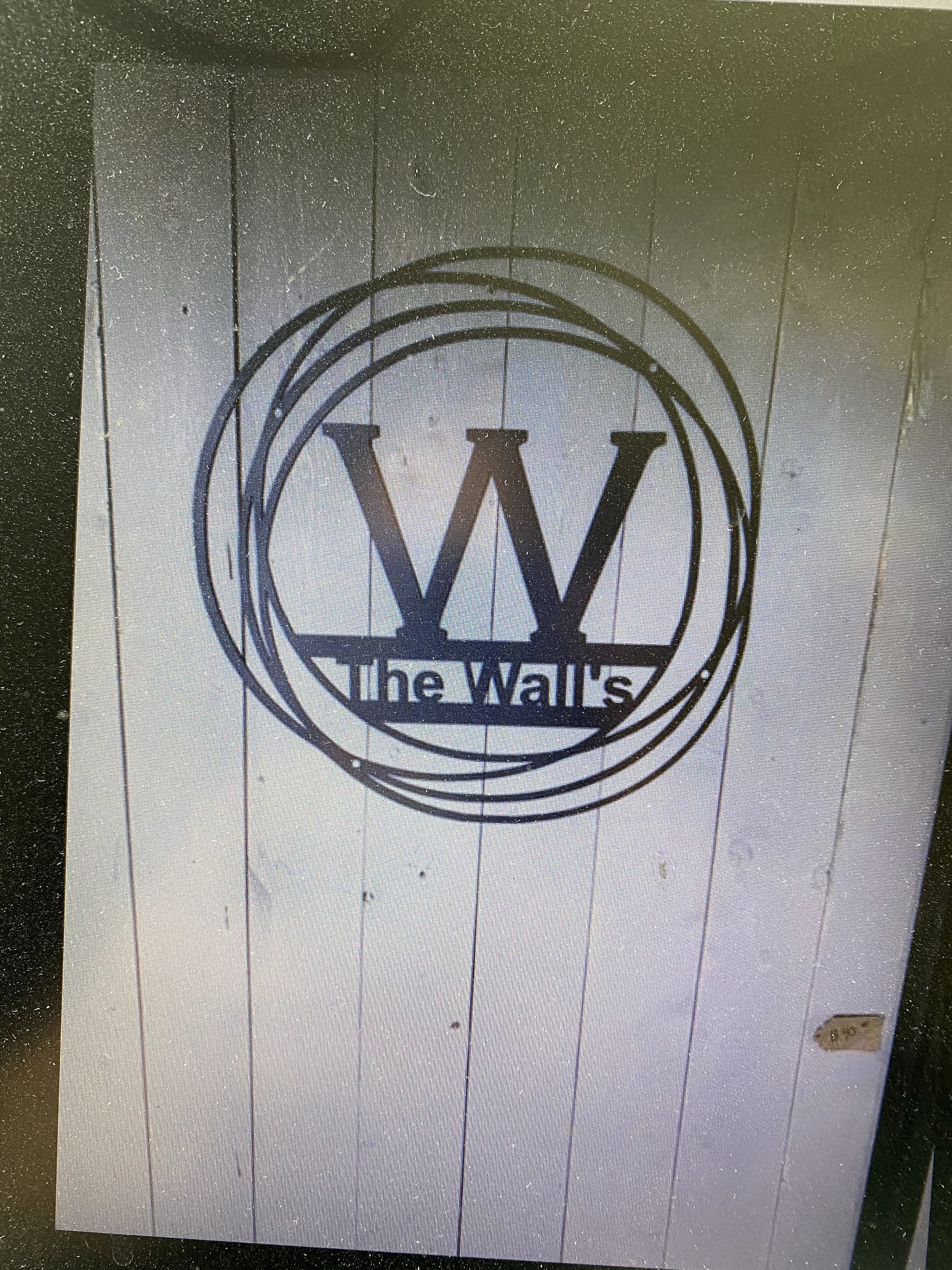 A decorative personalized laser-cut metal sign for family home, handmade in Saskatchewan
