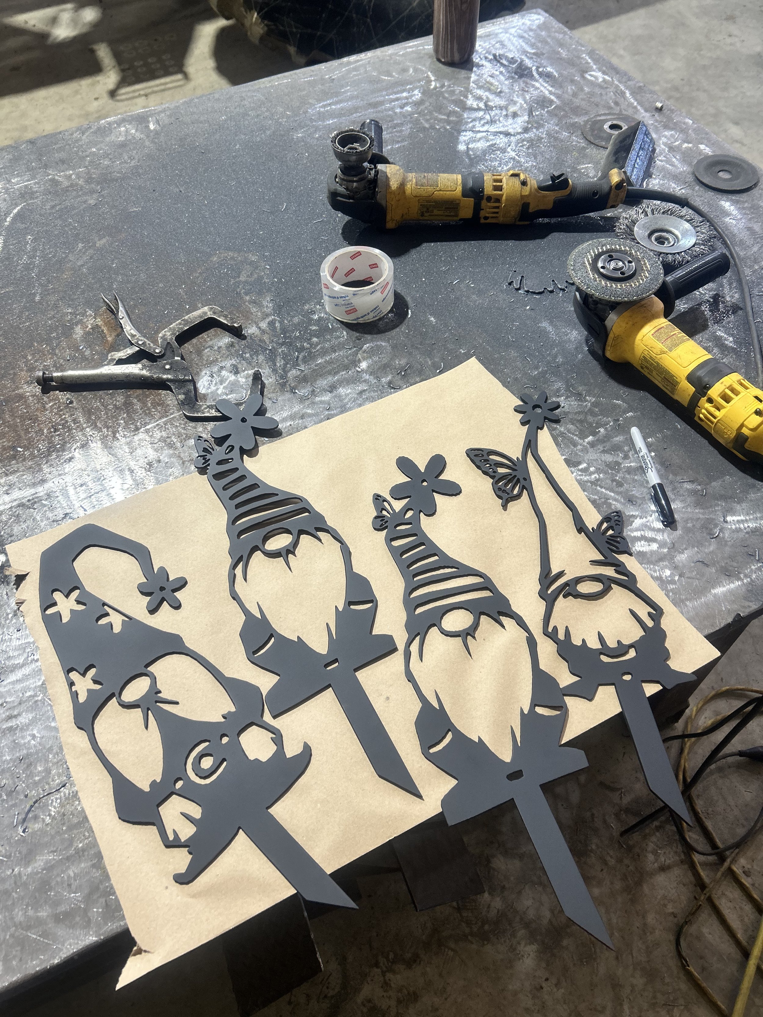 Modern metal artwork commission featuring Christmas gnomes, ideal for enhancing the exterior of your home for the holidays