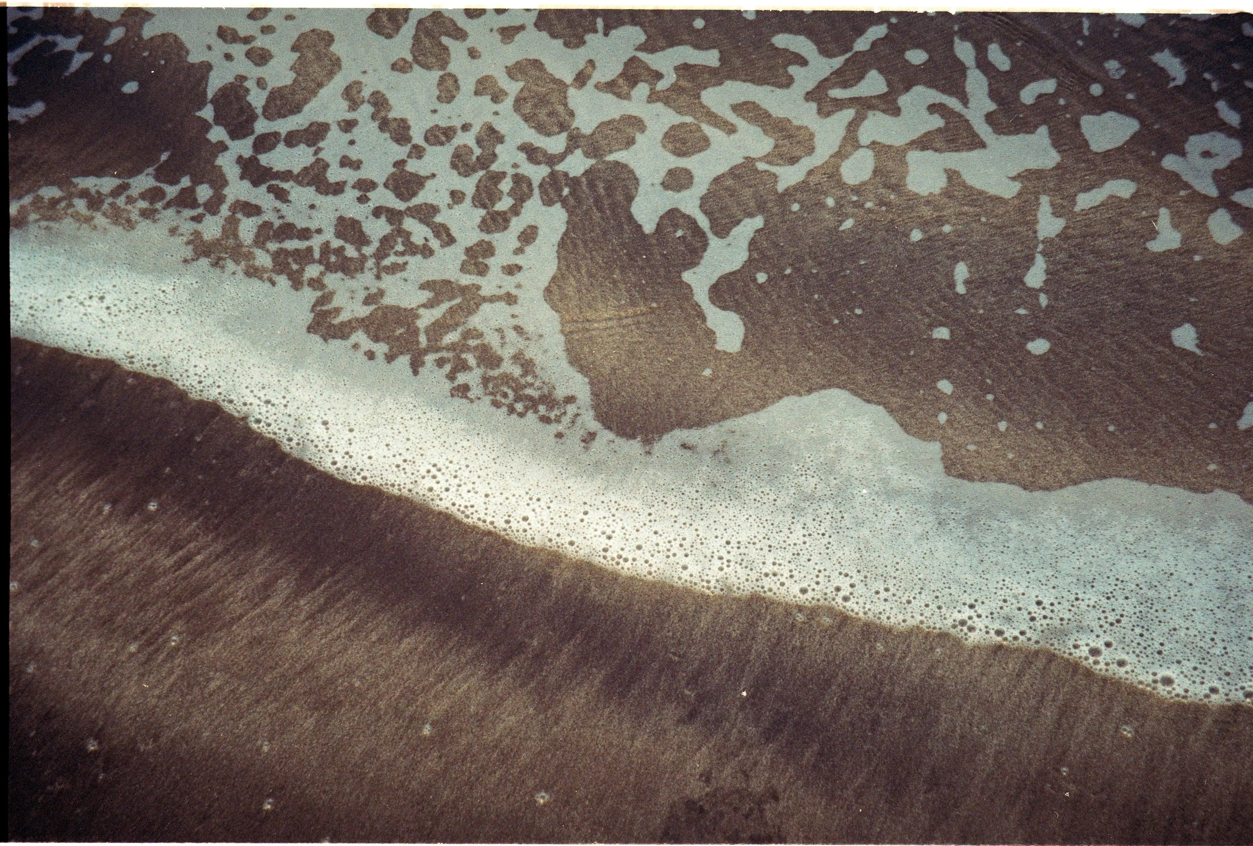 Rolling blue waves cresting and breaking across the ocean’s surface, symbolizing release, surrender, and the steady pulse of the sea