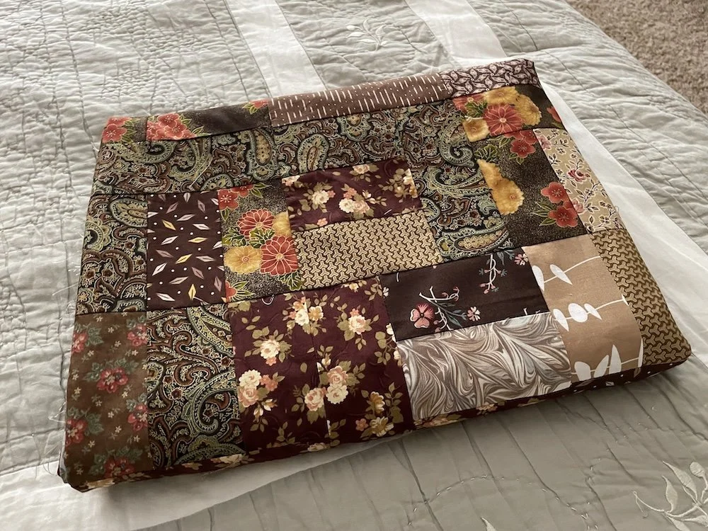 A folded, finished quilt top