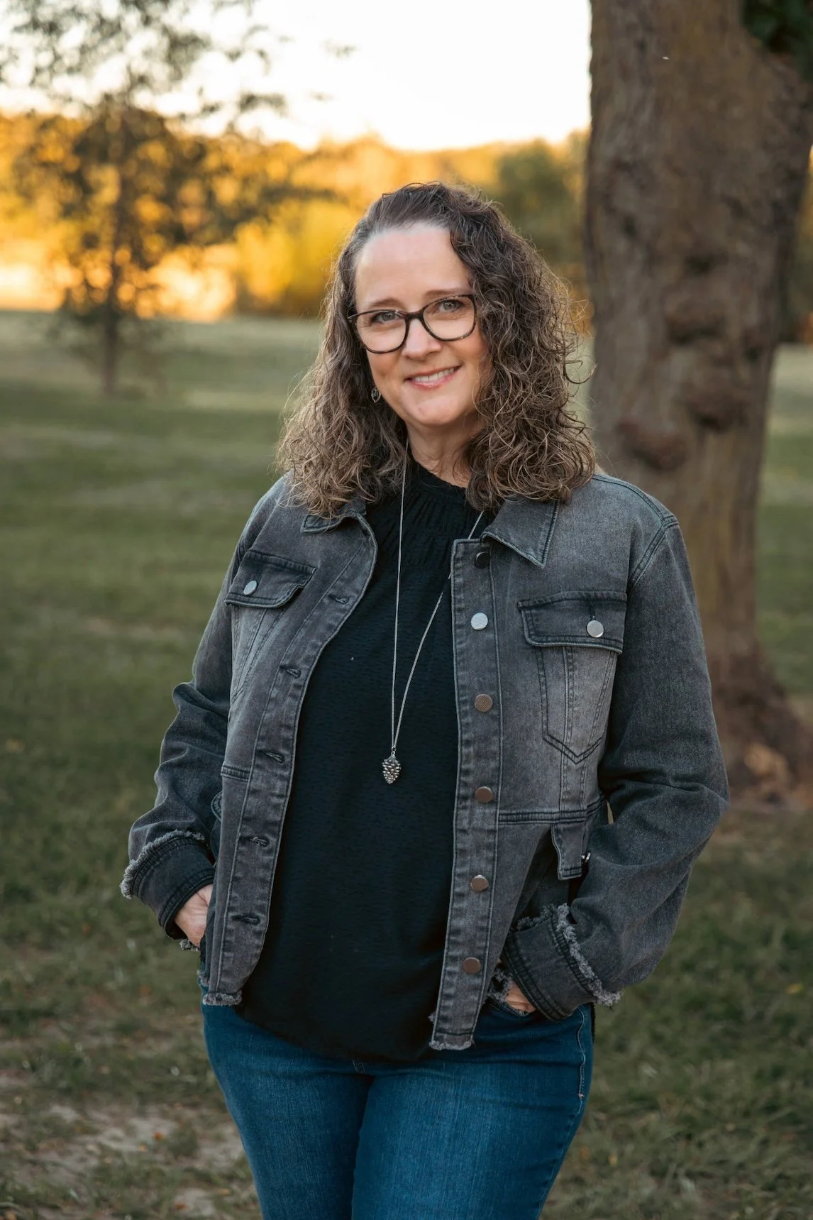 AuthoR Mickey Schoonover in a park at sunset.