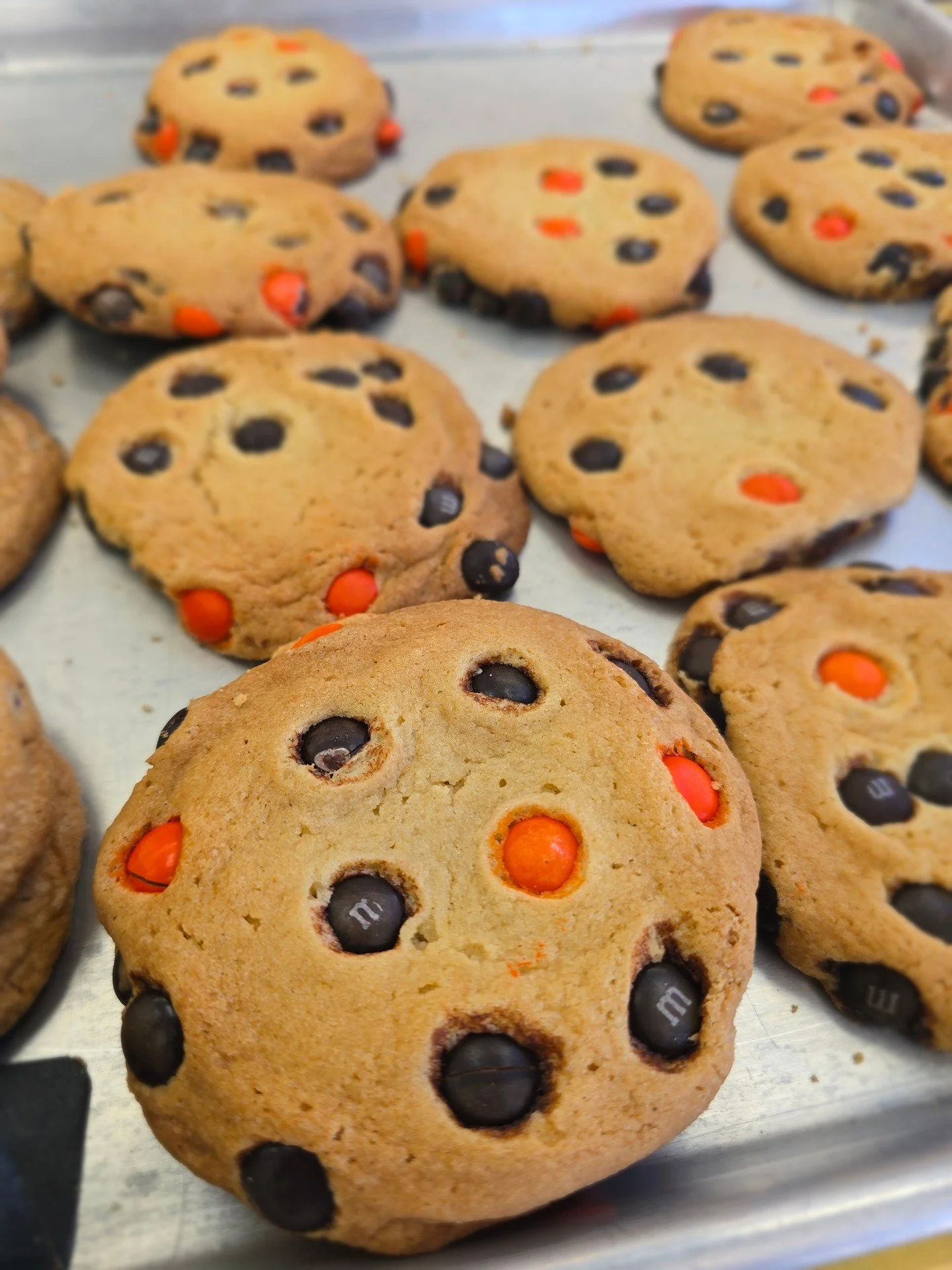 Unleashing a Halloween special at Antoines! Visit us today for some spooky and delicious Halloween M&amp;M cookies! #antoinespastryshop #bakingfun #cookies #m&amp;m #halloween #richthebaker