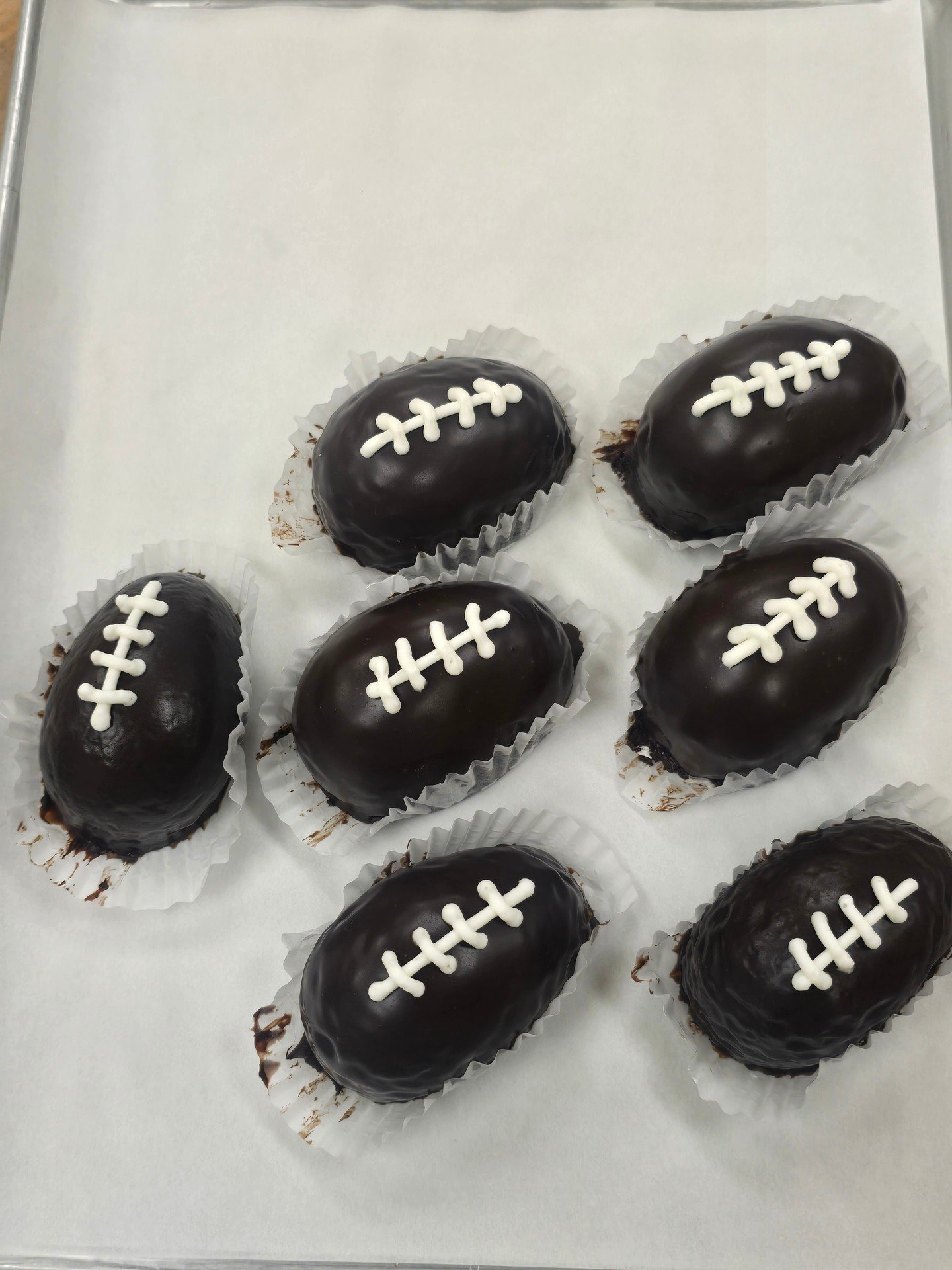 Good Morning! We have chocolate footballs for the play offs today!! stop in and get yourself your pregame sweets! #antoinespastryshop #bake #bakery #richthebaker #football #nfl #patriots #chocolate #chocolatecake
