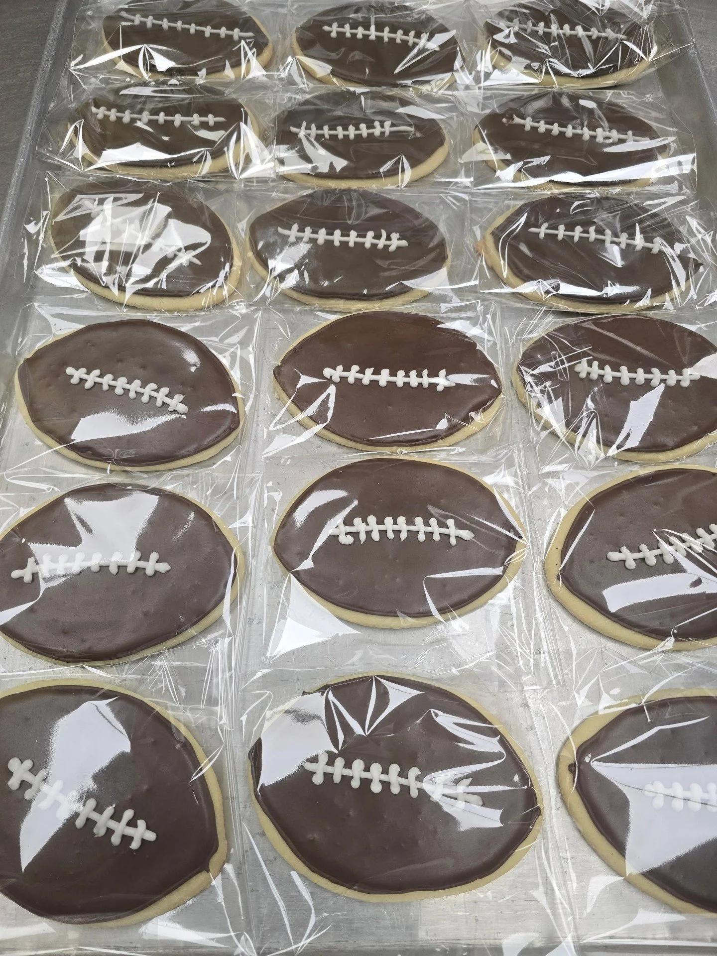 We have football sugar cookies!! Stop in today to grab yourself the perfect super bowl dessert! #antoinespastryshop #NFL #superbowl #royalicing #sugarcookie #richthebaker #patsnation #patriots