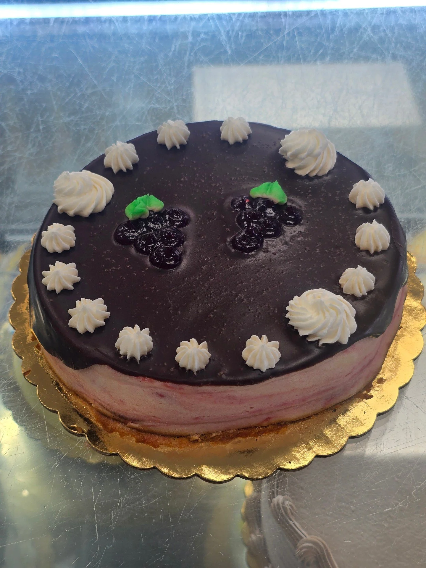 Raspberry Cheesecake!! topped with chocolate ganache and garnished with our homemade frosting!! #antoinespastryshop #cheesecake #cheese #raspberry #dessert #richthebaker #fruit