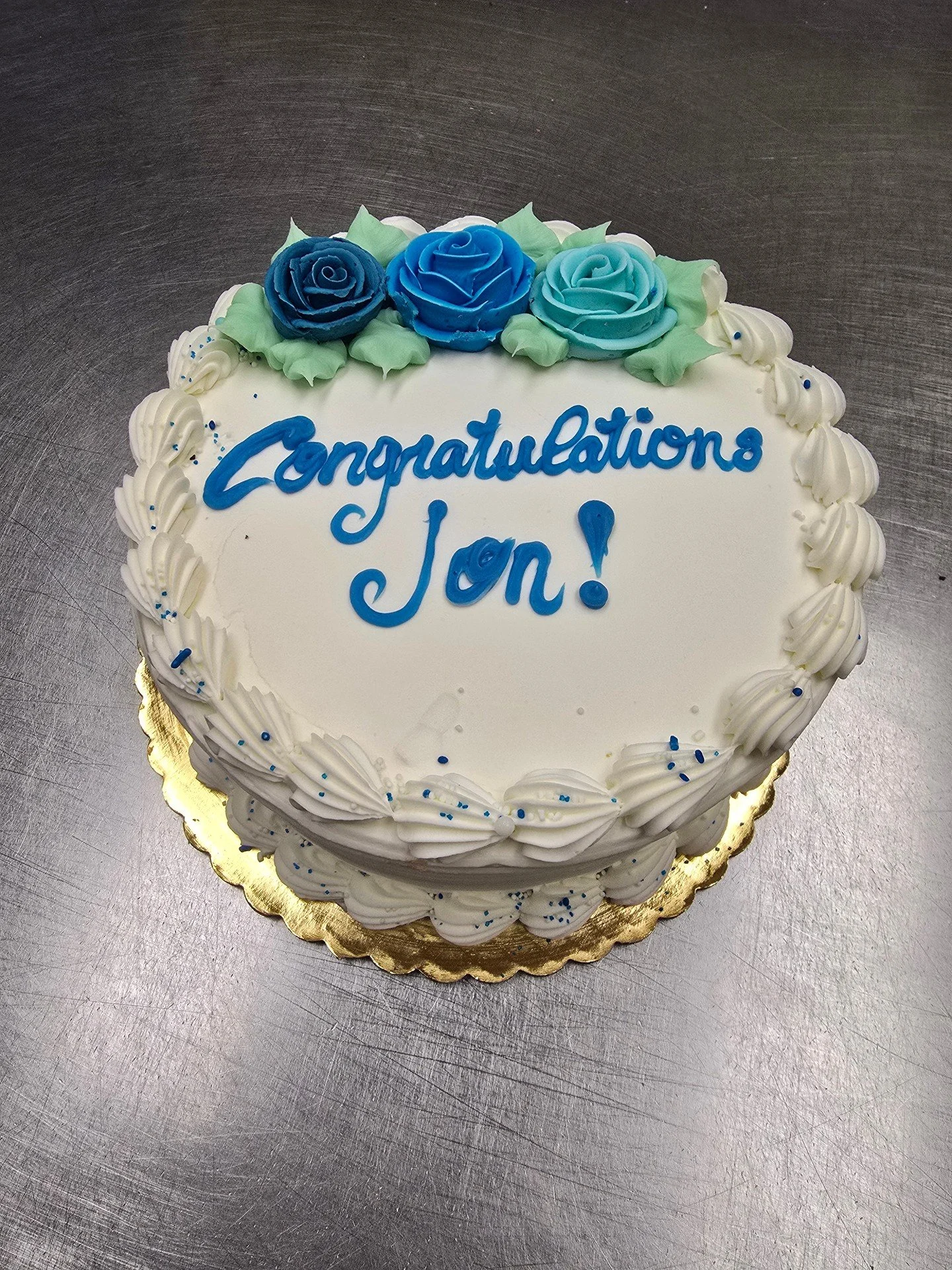 Congratulations Jon! #antoinespastryshop #cake #cakes #customcake #richthebaker #vanilla #frosting #bluefrosting