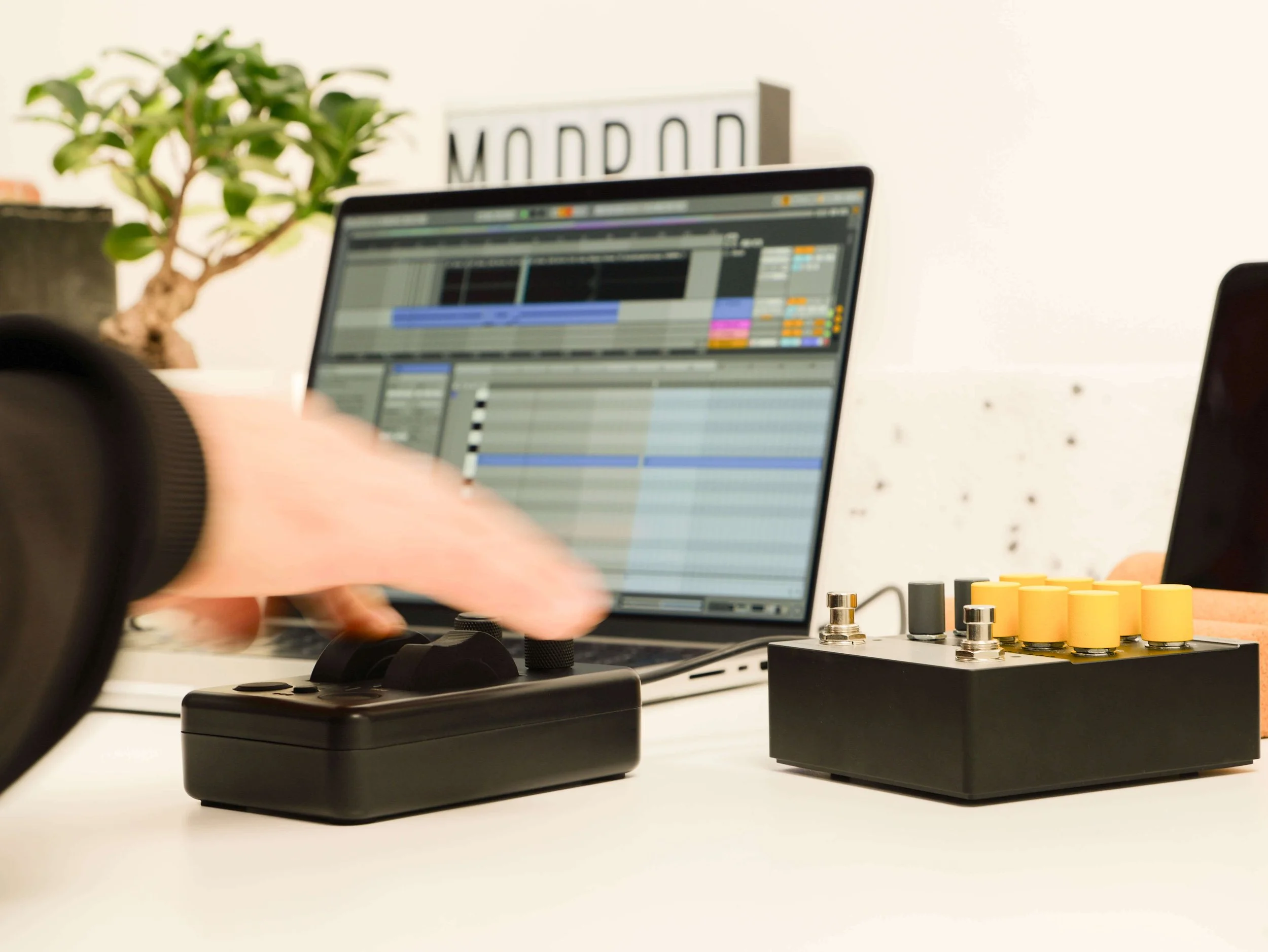 AM components MIDI device with full pitch wheel and mod functionality being used in a clean studio setting