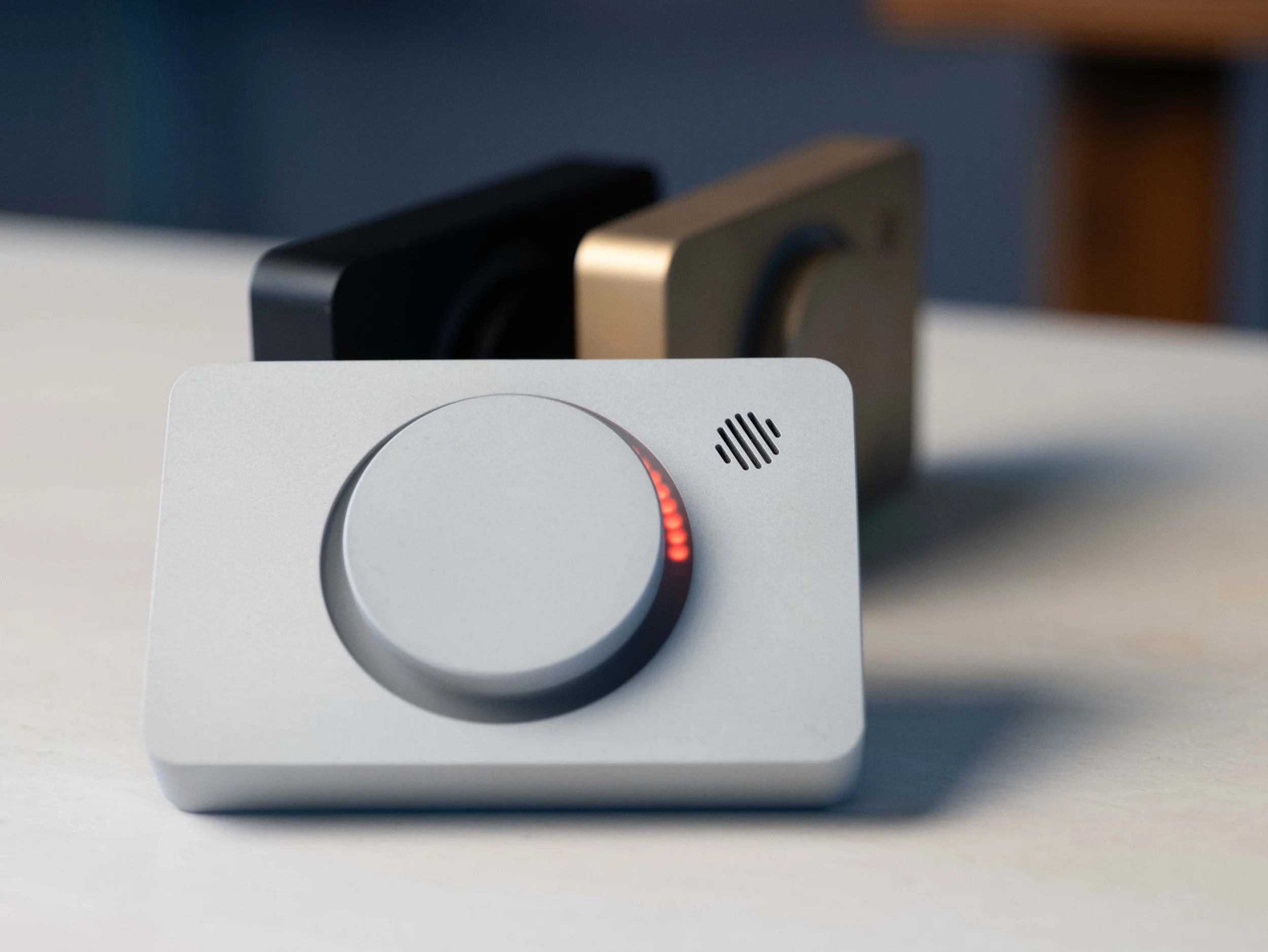Three Pomodoro Timers on white desk casting shadow from natural light