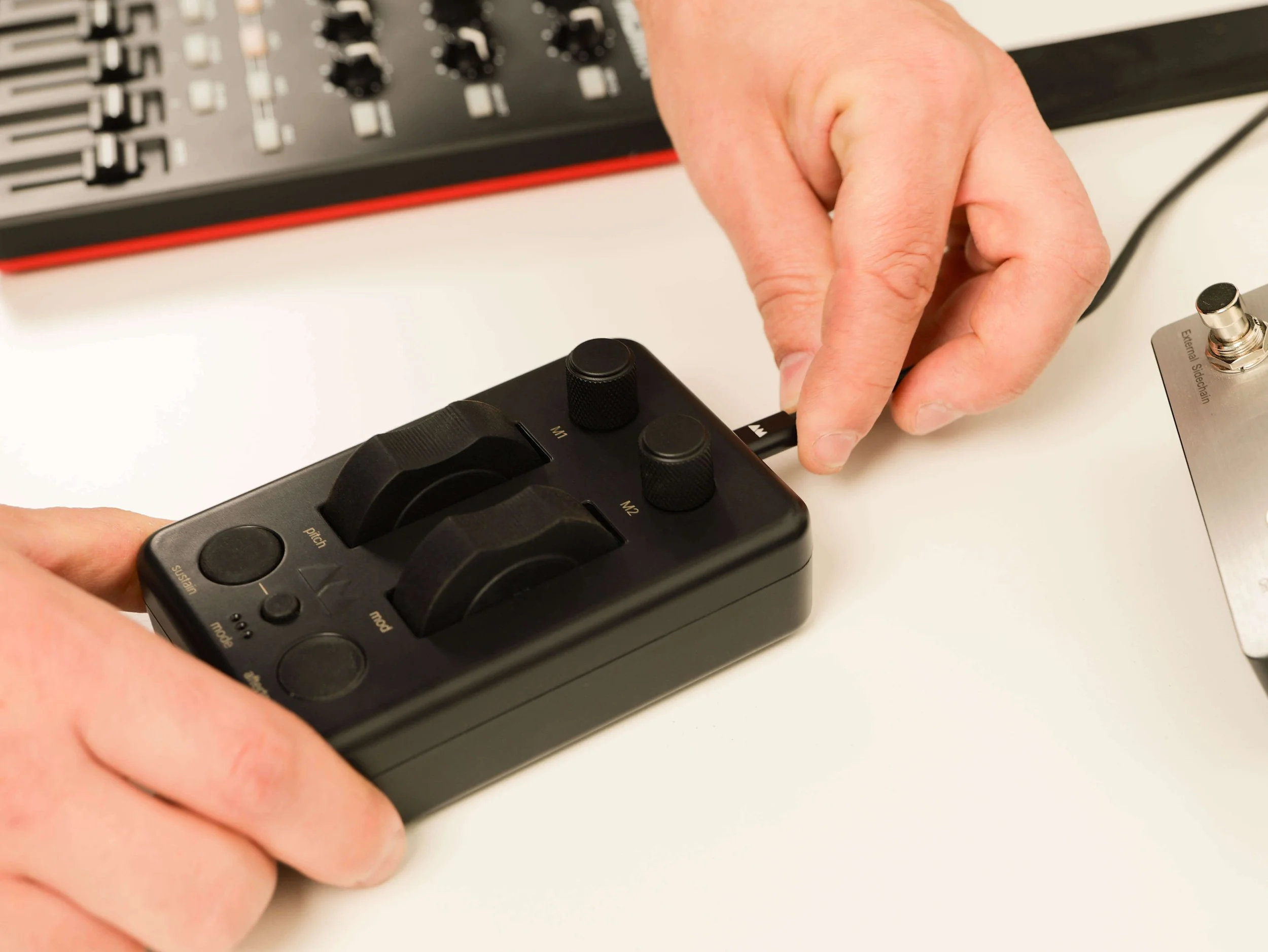 MIDI over USB shown with custom AM components cable being inserted