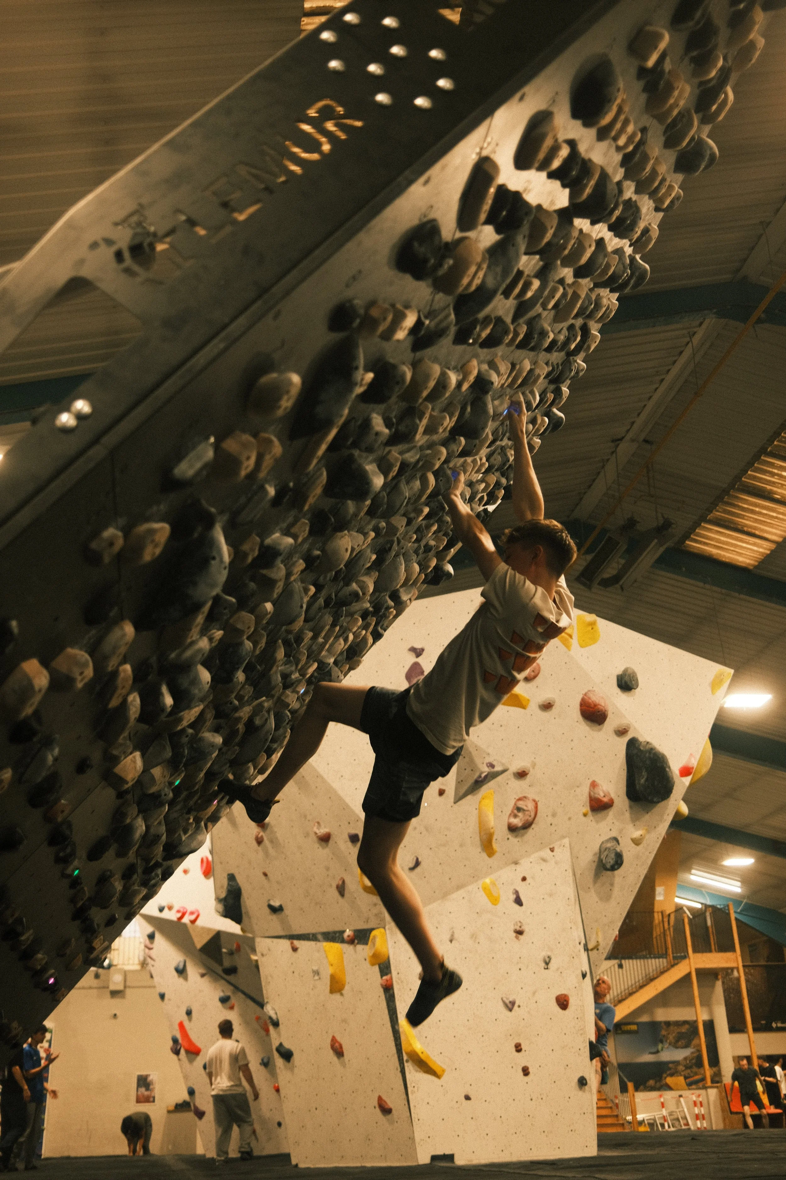 Indoor bouldering on a steep overhang