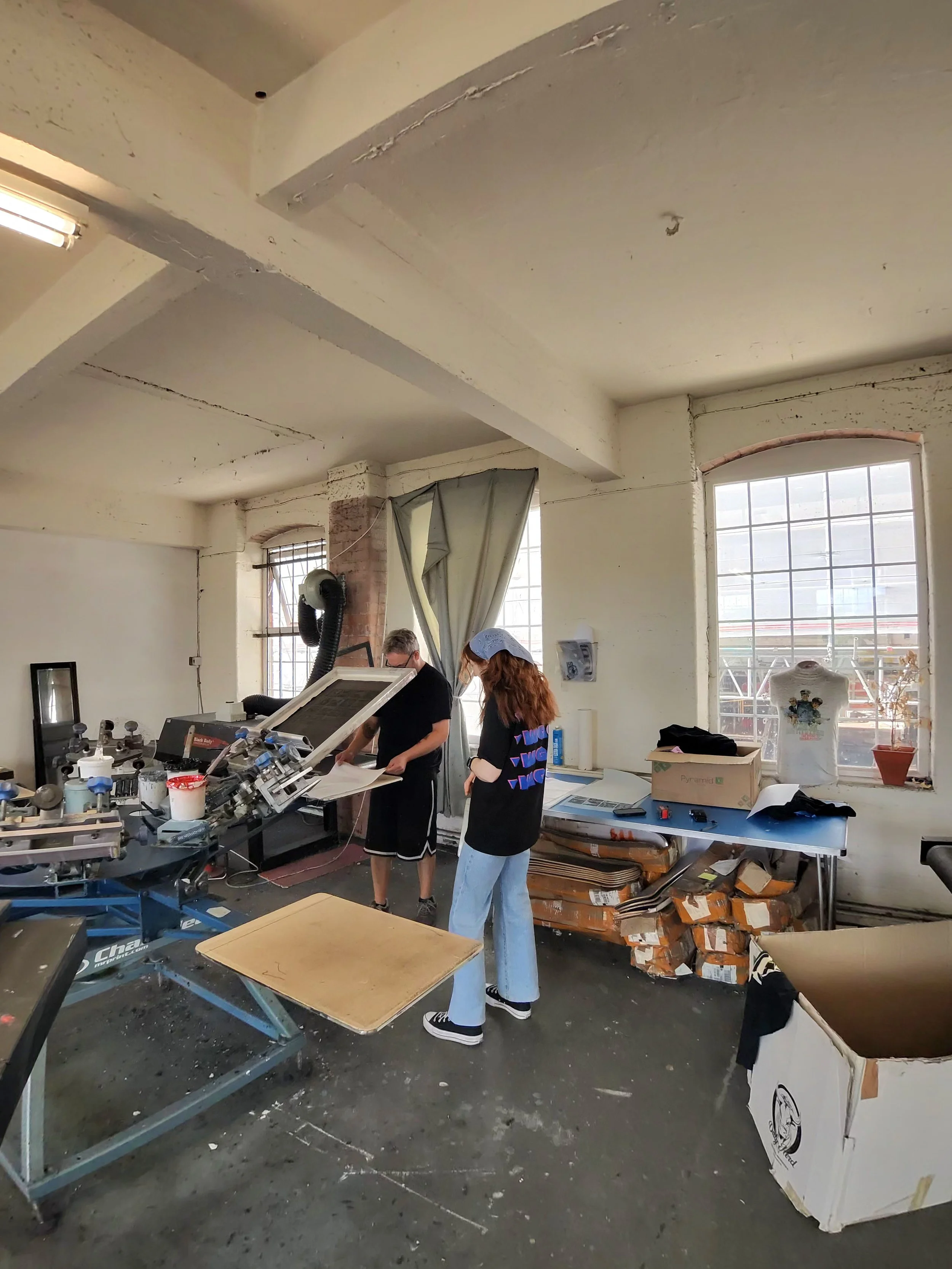 Winter Grit clothing being screen printed in a workshop