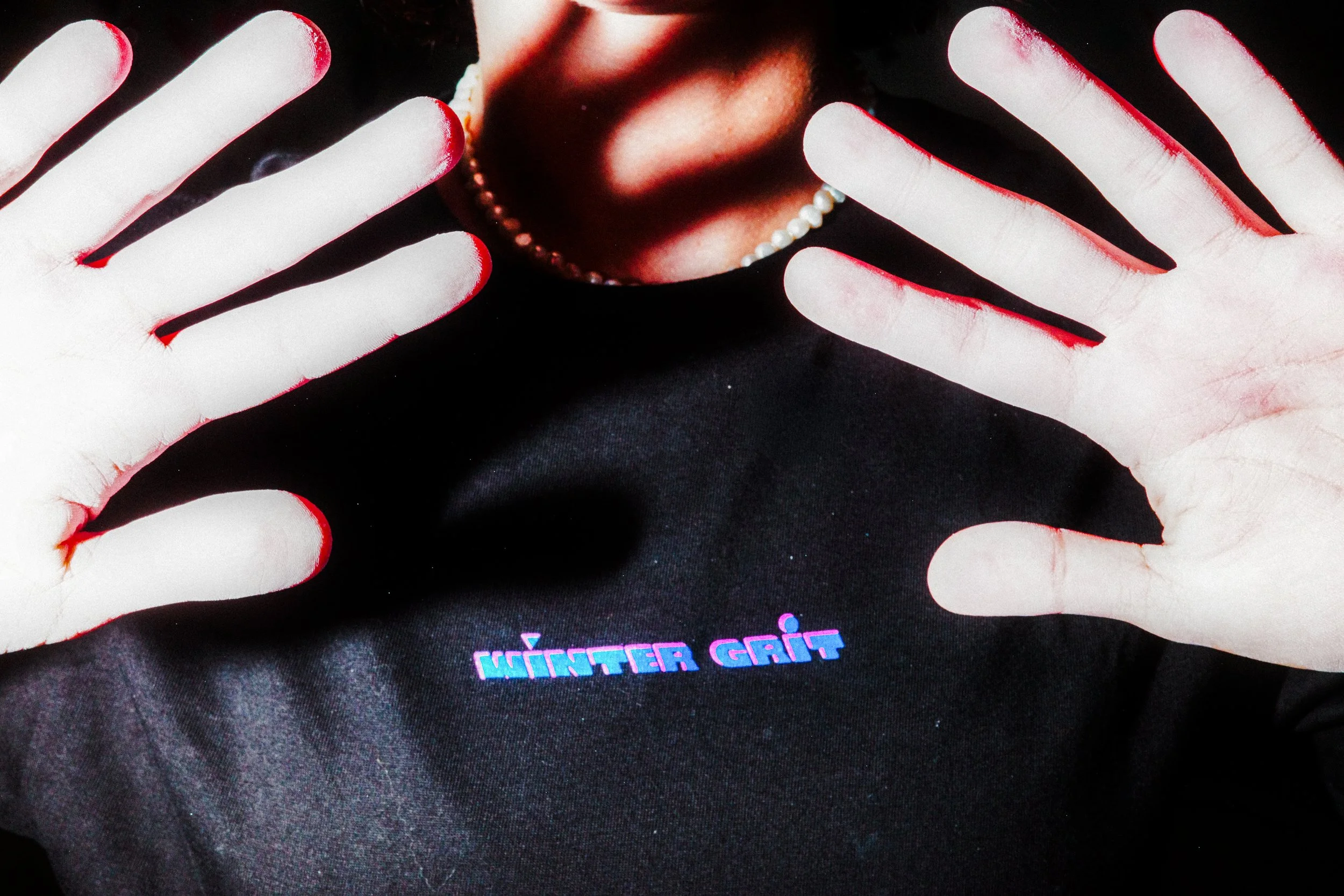 Close-up of a black Winter Grit climbing T-shirt