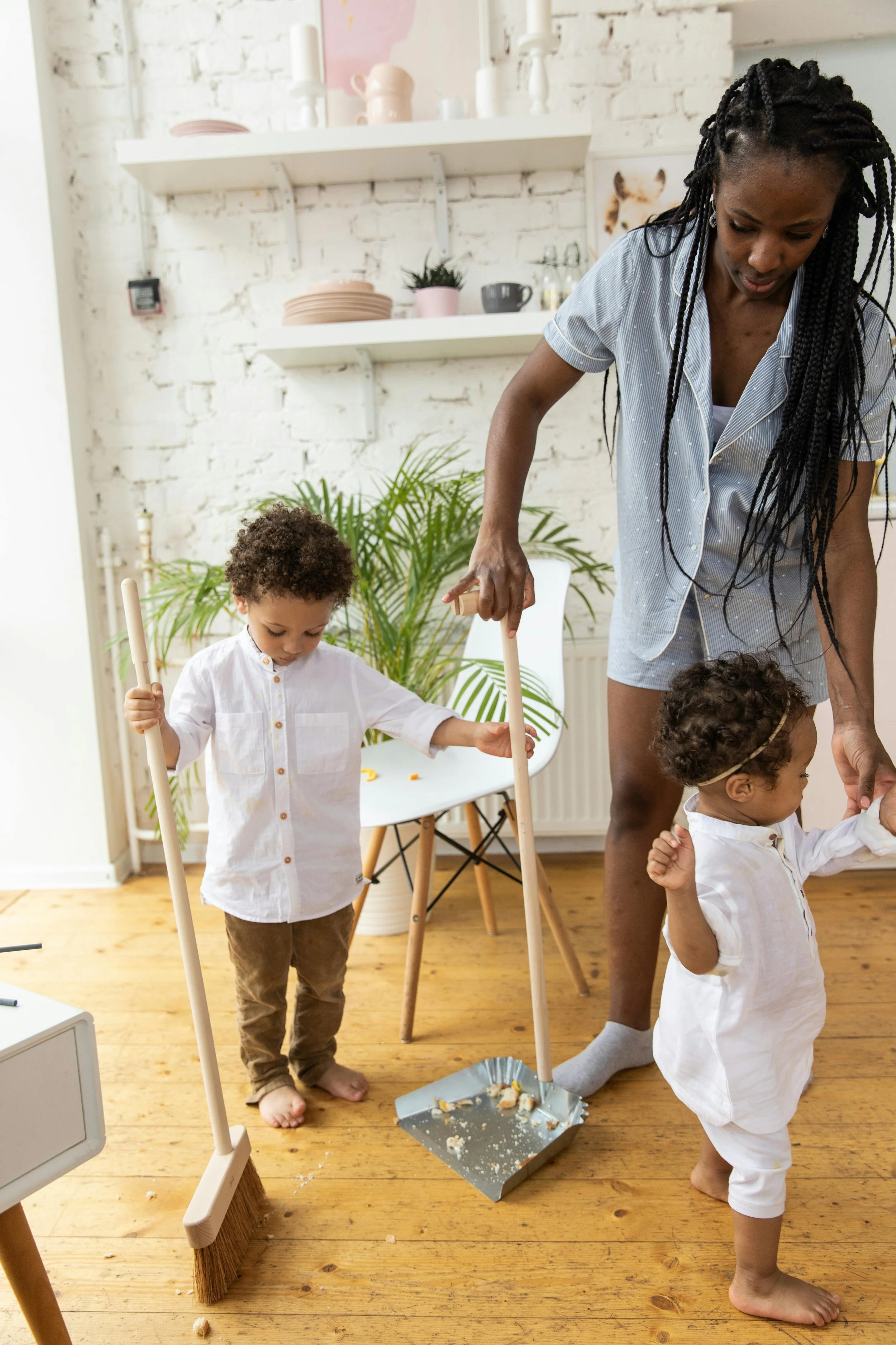 parent teaching a child how to do chores