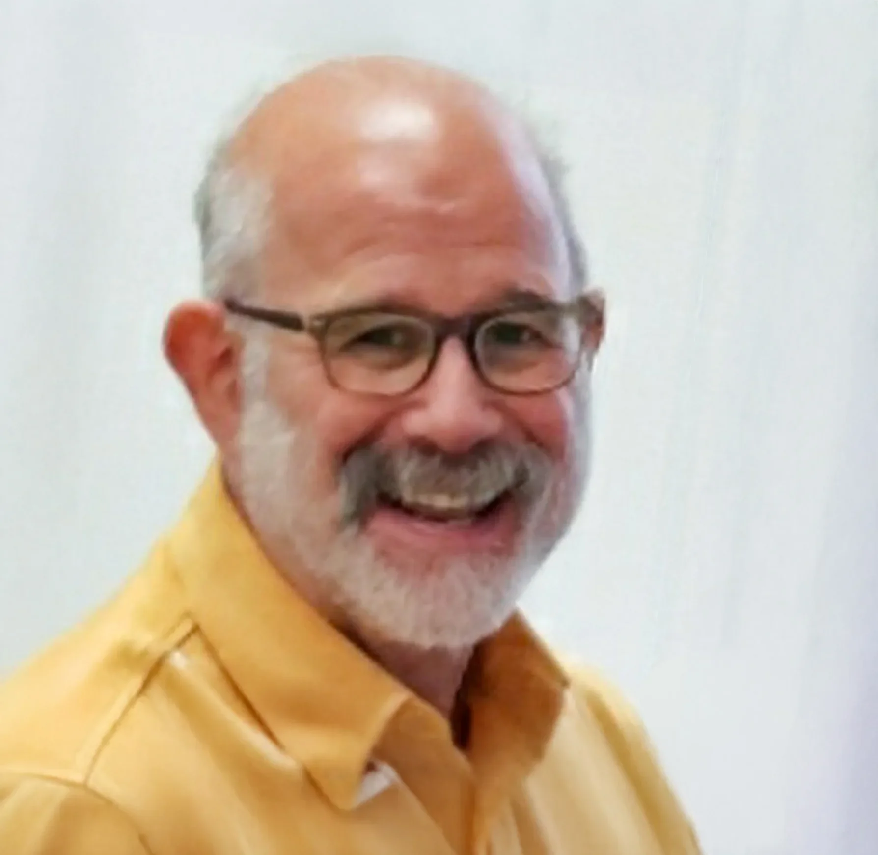 an image of Alan Wenderoff smiling at the camera
