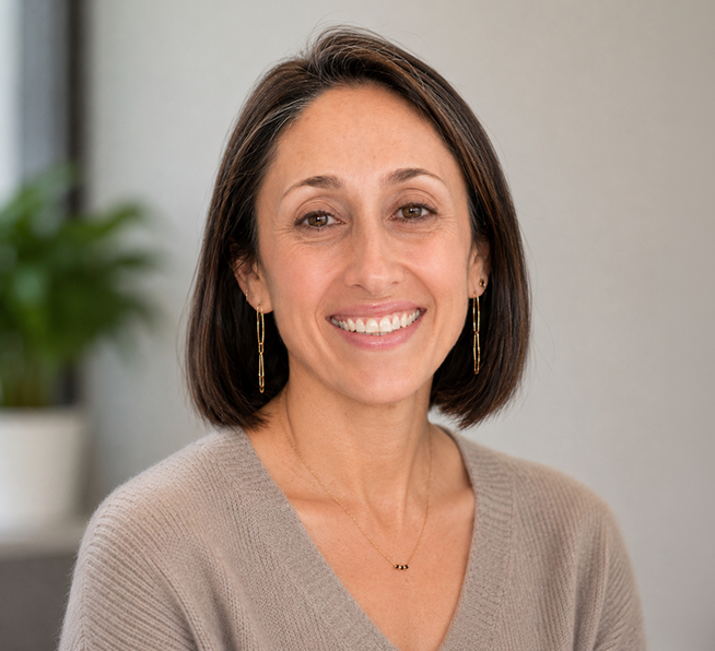 an image of Dr. Layne Raskin smiling at the camera