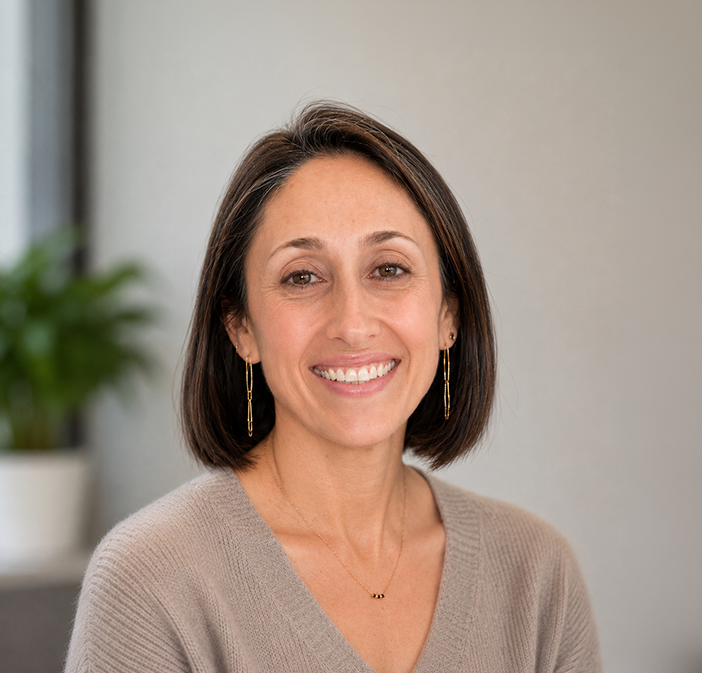 an image of Dr. Layne Raskin smiling at the camera