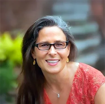 an image of Beth Friedberg smiling at the camera