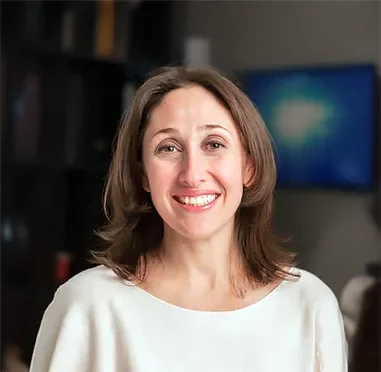 an image of Dr. Layne Raskin smiling at the camera