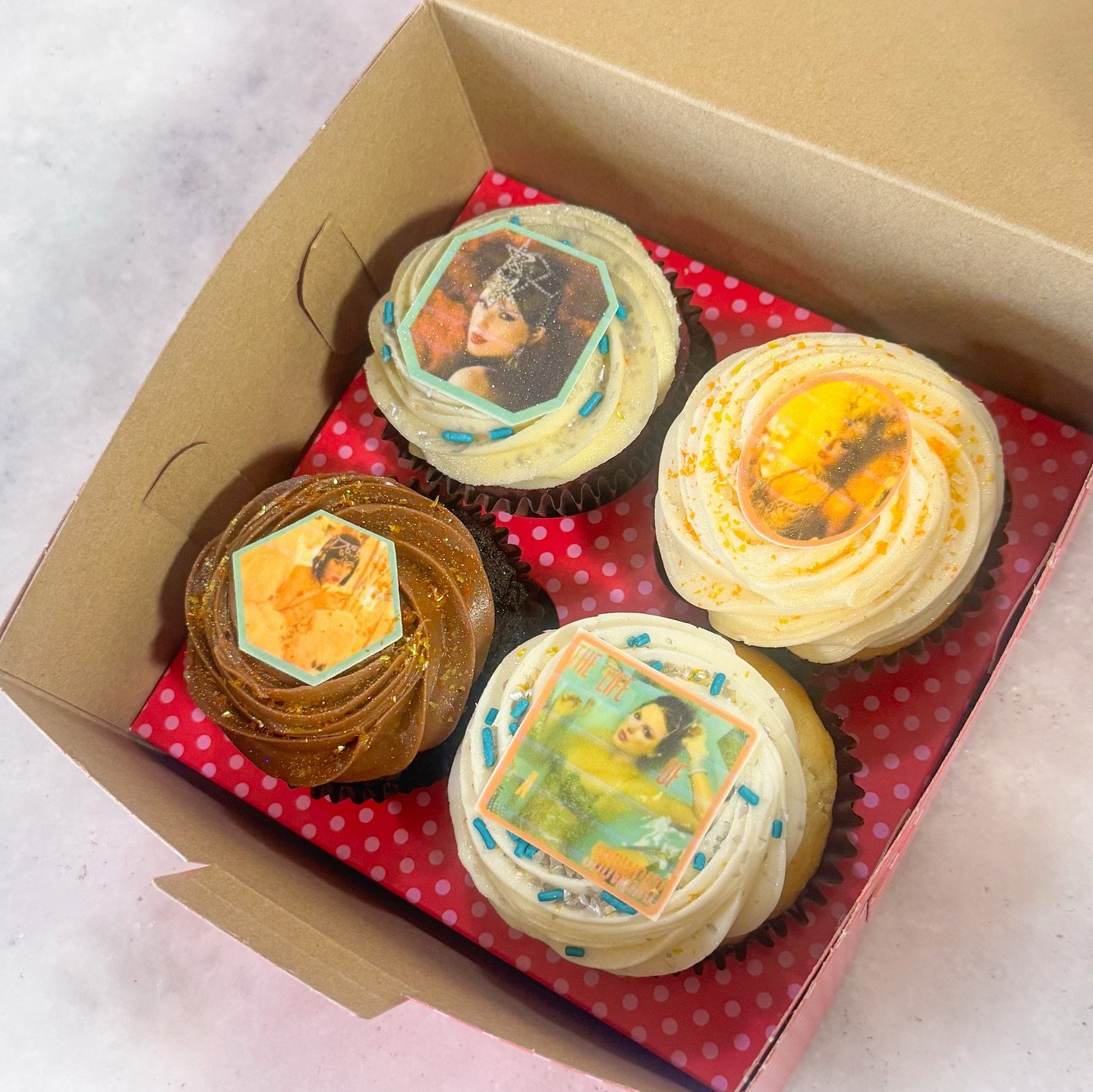 To those that celebrate.. 🧡💙

New Taylor Album, New Cupcakes from @smallcakesbatonrouge!

We&rsquo;ve got a lineup as iconic as a tracklist:
❤️ Red Velvet
🍫 Chocolate on Chocolate
🤍 Wedding Cake
🤍 Vanilla on Vanilla

Grab the 4-box set for $28 t