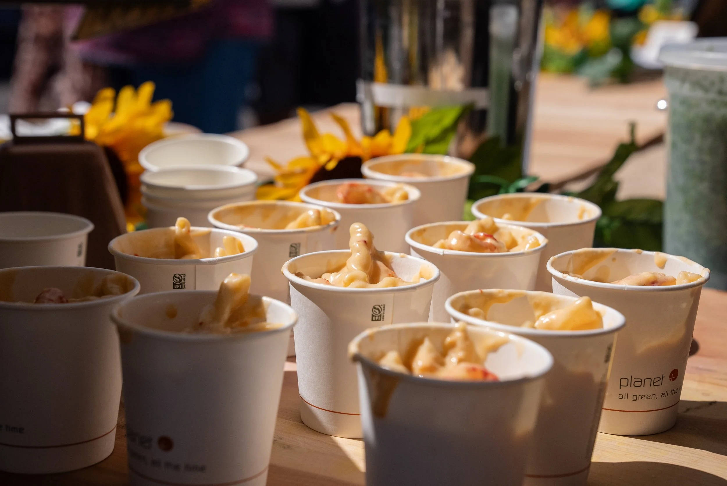 cups of macaroni and cheese ready to be served at the Mactoberfest Event