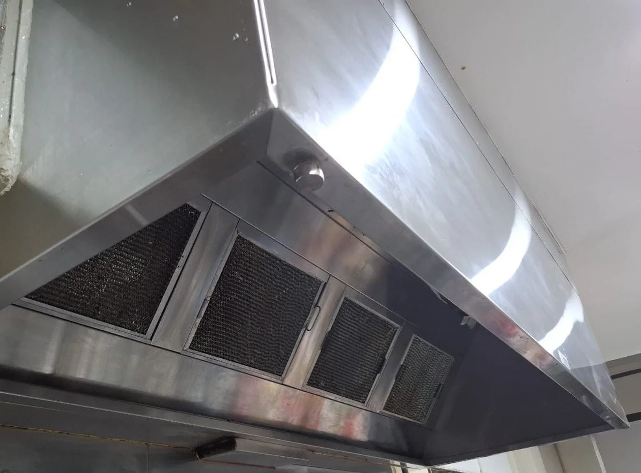 Clean kitchen exhaust hood with filters.