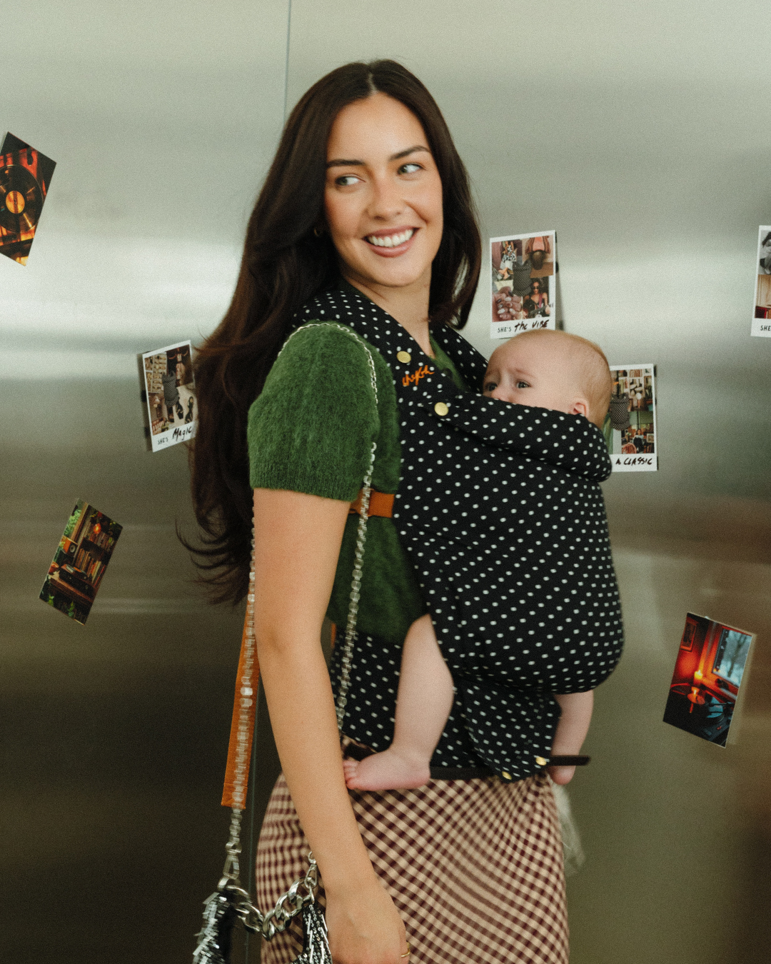 Storie Studio stainless steel backdrop for photgraphy and content - mother and baby in a chekoh baby carrier 