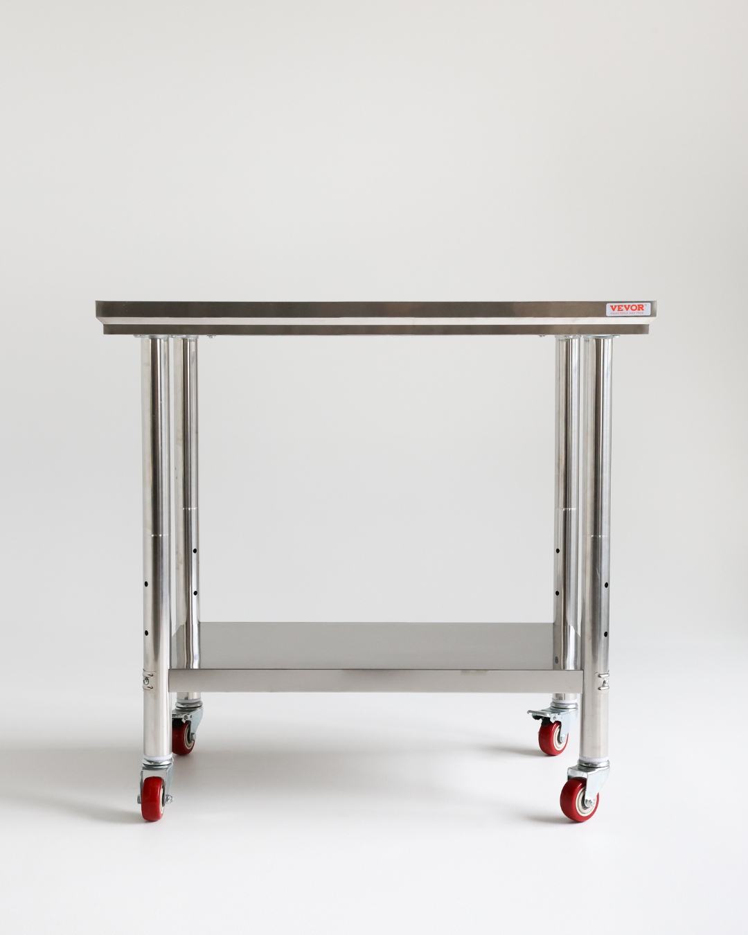 Metal utility cart with four red wheels against a plain white background.