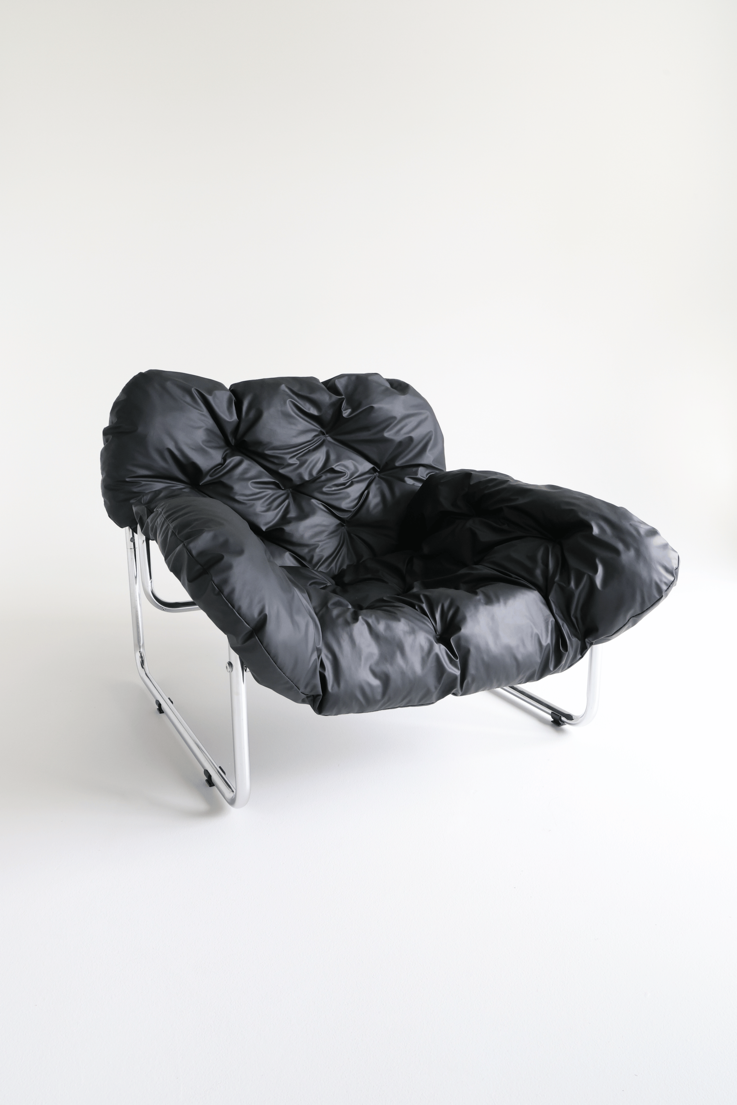 Black and chrome textural prop arm chair