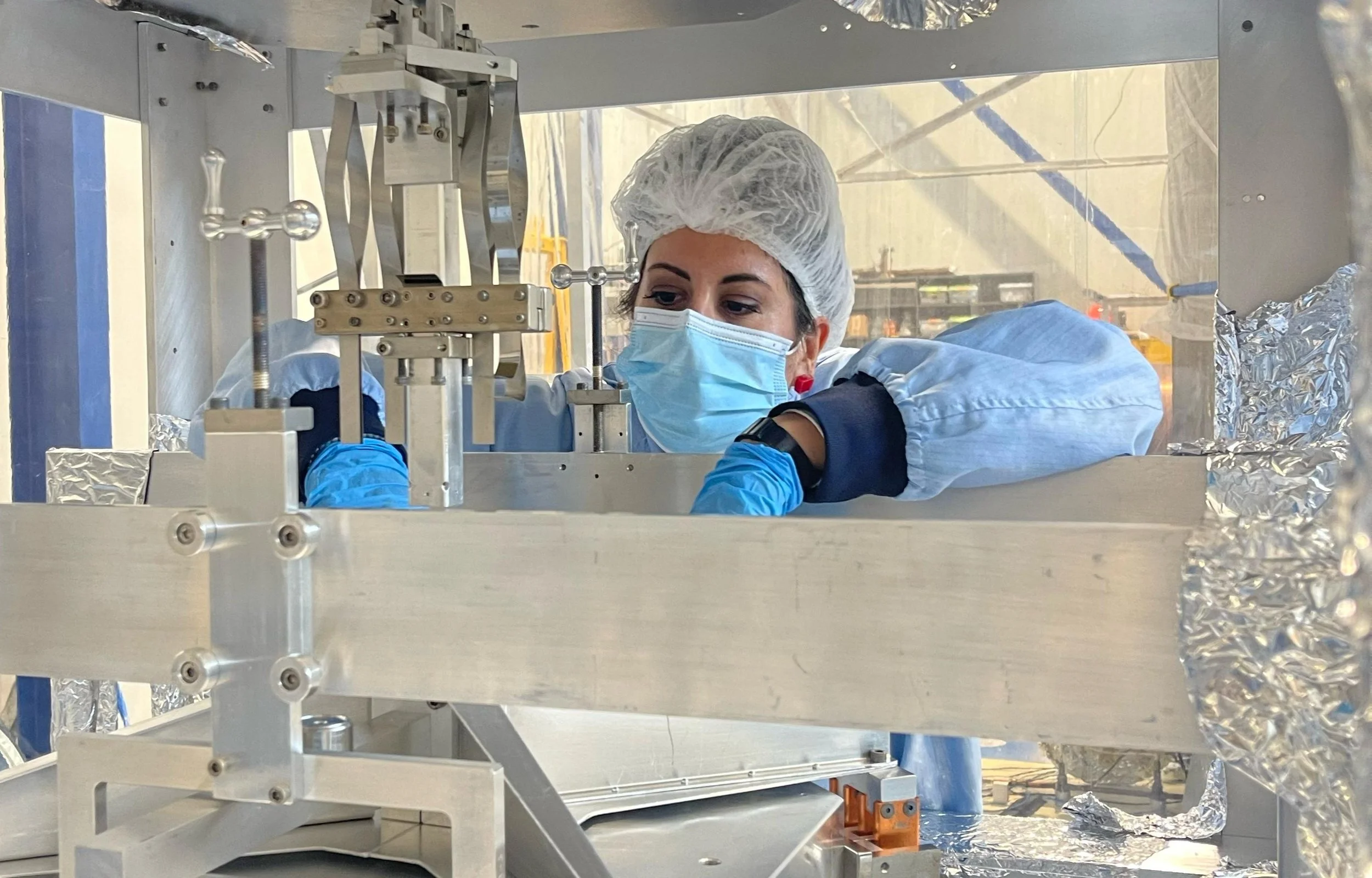 Dr. Chiara Di Fronzo working on the visbration isolarion system for gravitational wave detection at the Gingin High Optical Power Facility