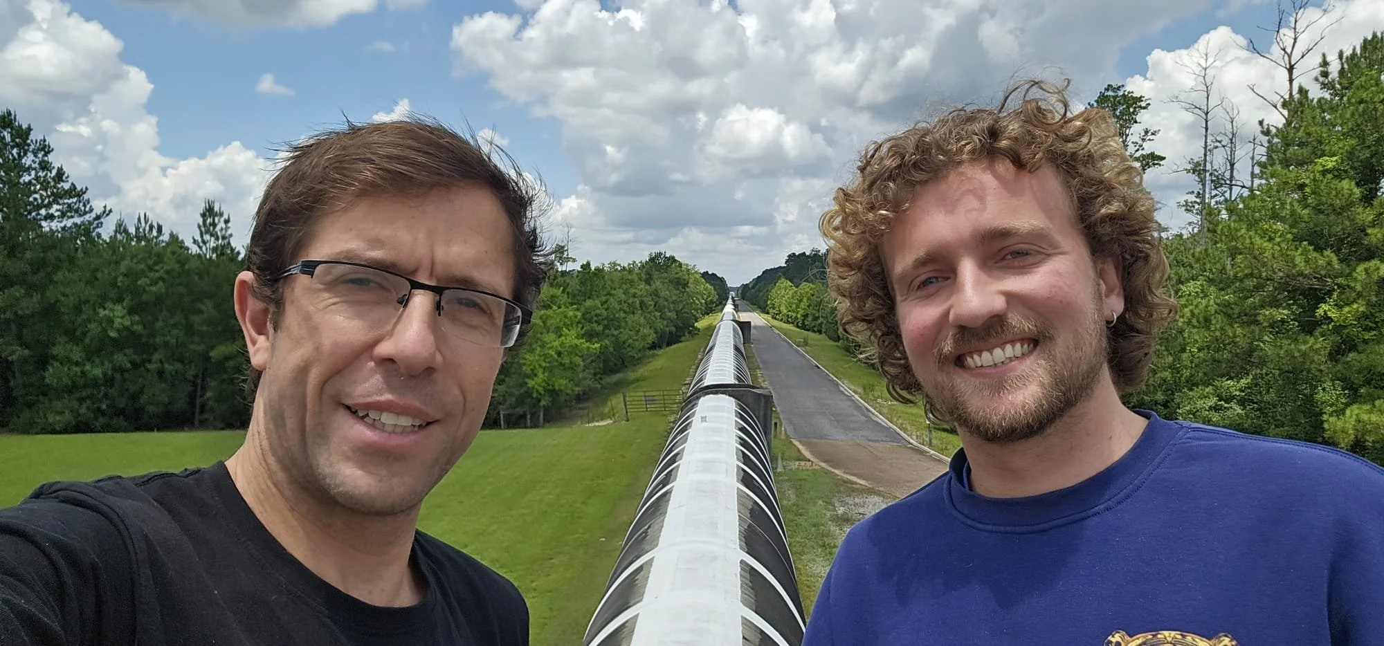 PhD student Kho Baker (right) and Research Fellow Carl Blair beside the LIGO 4km vacuum pipe (2026).  They were working with themal compensation system at LIGO.