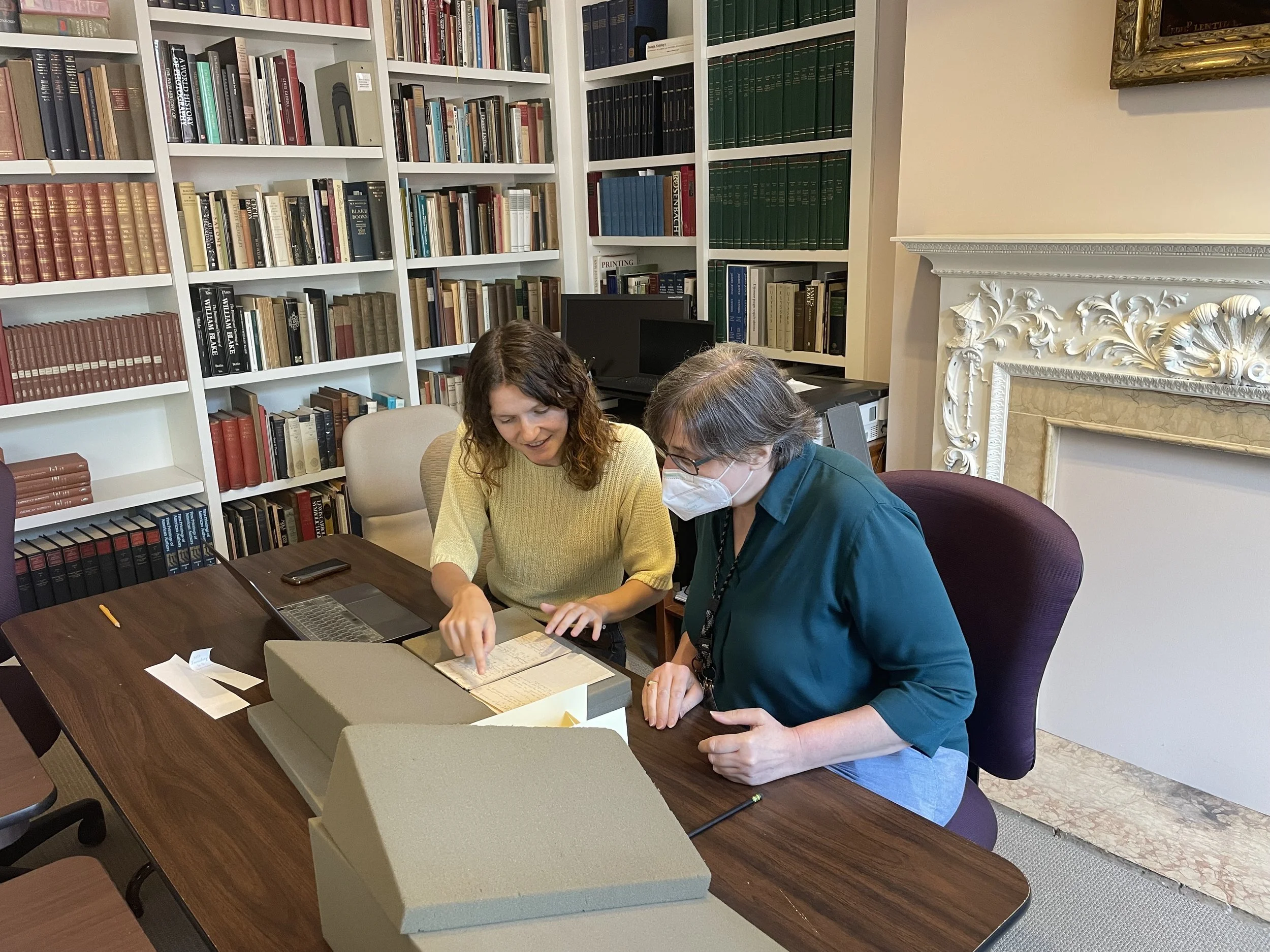 Librarian Elizabeth E. Fuller supports researcher Celine Shanosky in the Reading Room. Image courtesy of David Rhys Owen