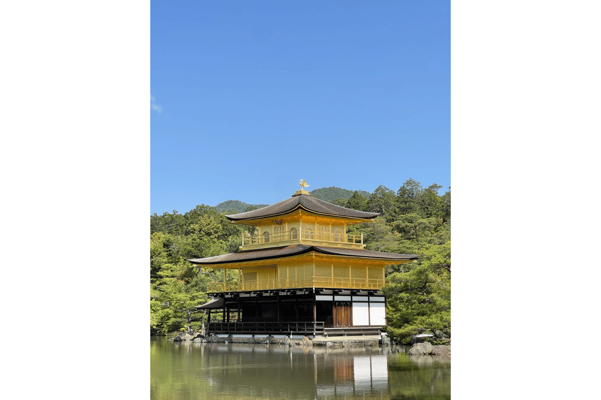 Traditional Japanese temple and shrine surrounded by nature, representing respectful sightseeing and cultural etiquette in Japan.