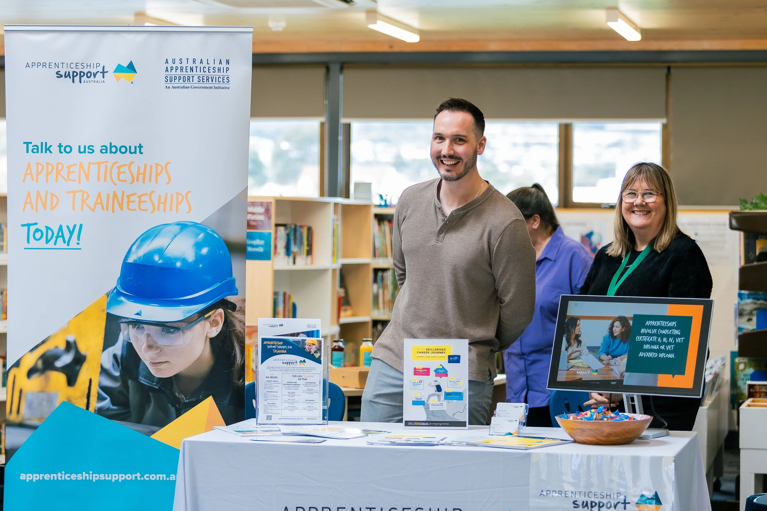 Friendly expo representatives at the Apprenticeships and Traineeships stand at Emmanuel Christian School's Careers Expo in Rokeby, Tasmania
