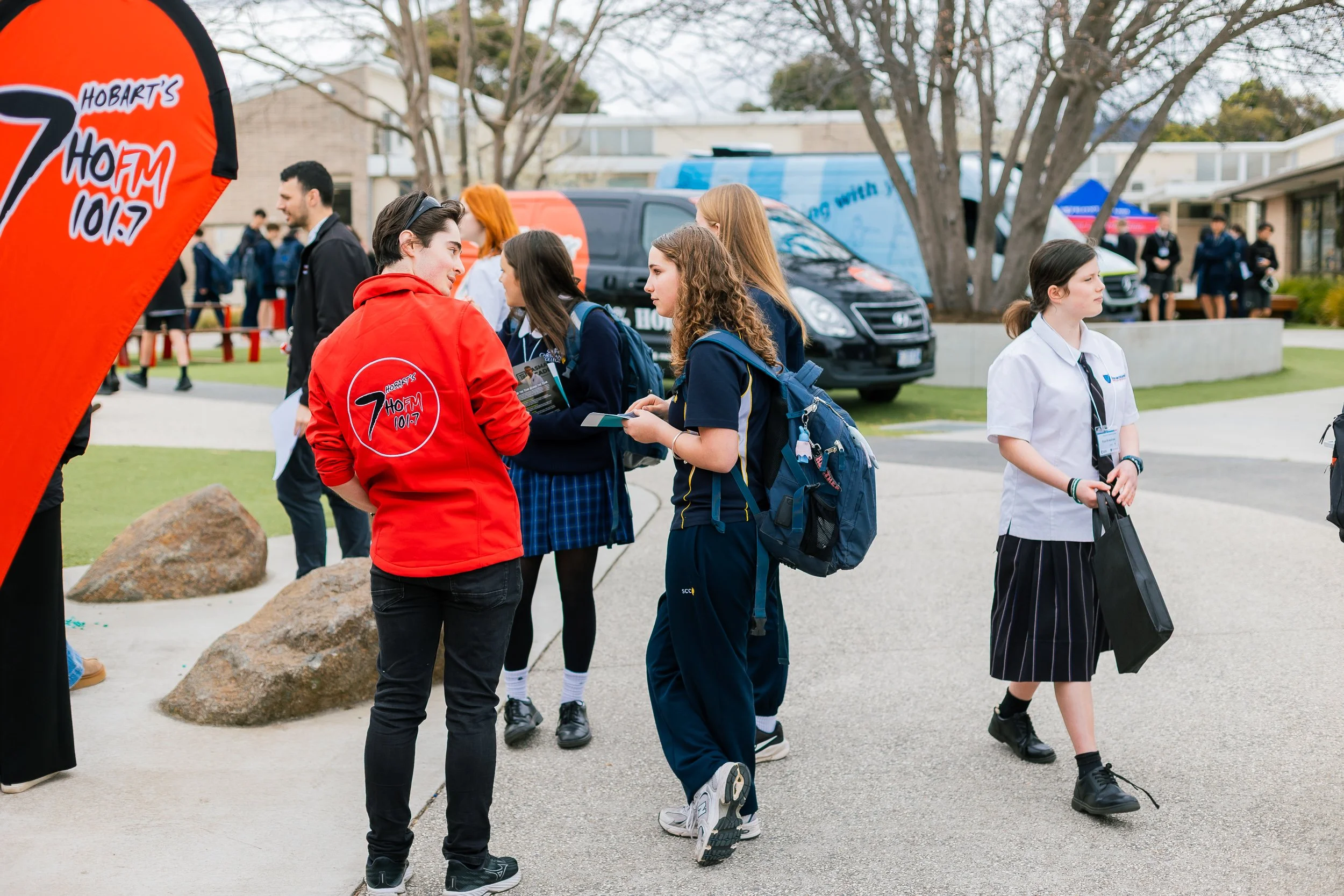 Emmanuel Christian School student speaking with a HOFM radio representative at the Careers Expo in Rokeby, Tasmania