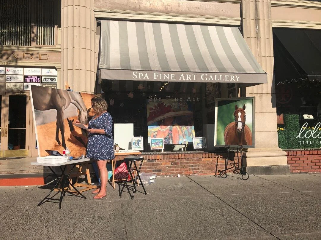 Jessica Leoanrd painting in front of Spa Fine Art gallery Travers weekend 2019