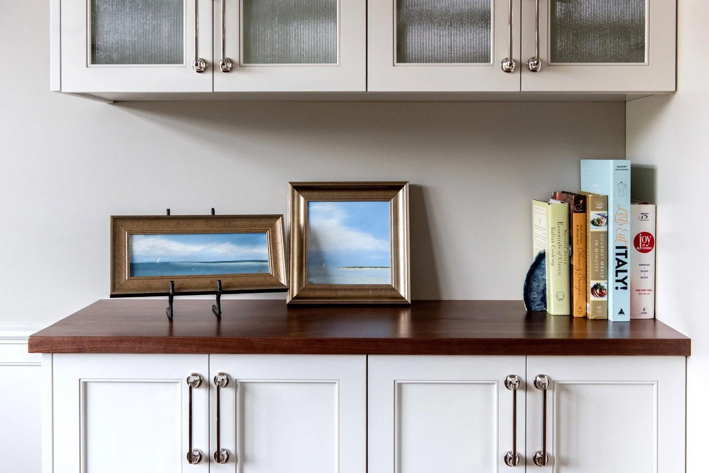 Small paintings, styled to perfection.

Artwork by Laurie Johnstone framed and featured in a custom interior by Elizabeth Tanny &mdash; proving that original art can transform even the smallest spaces. From kitchen shelves to cozy corners, these piec