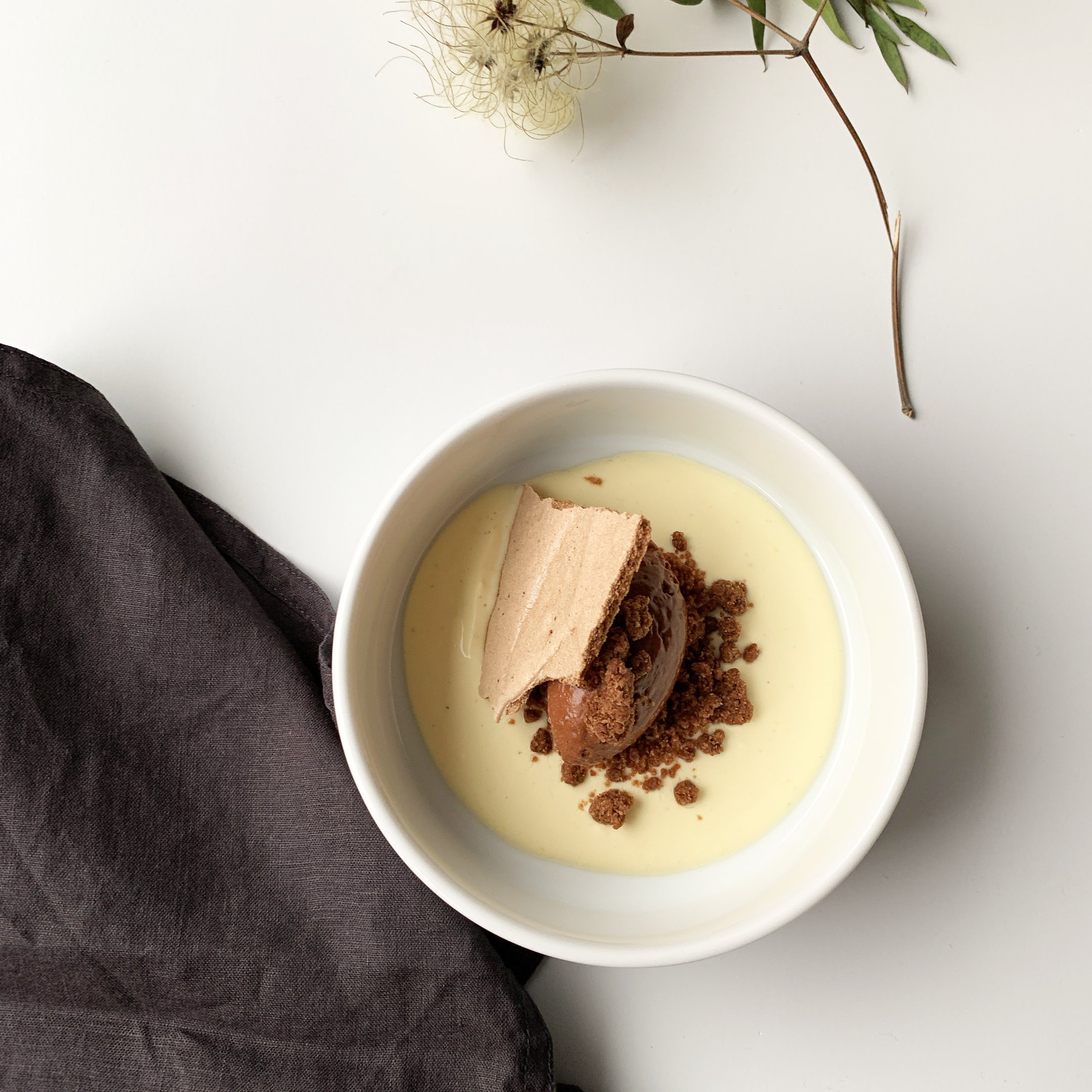 Dessert: chocolate Sichuan pepper mousse, crème anglaise with kefir leaves, dark salty crumble and chocolate meringue