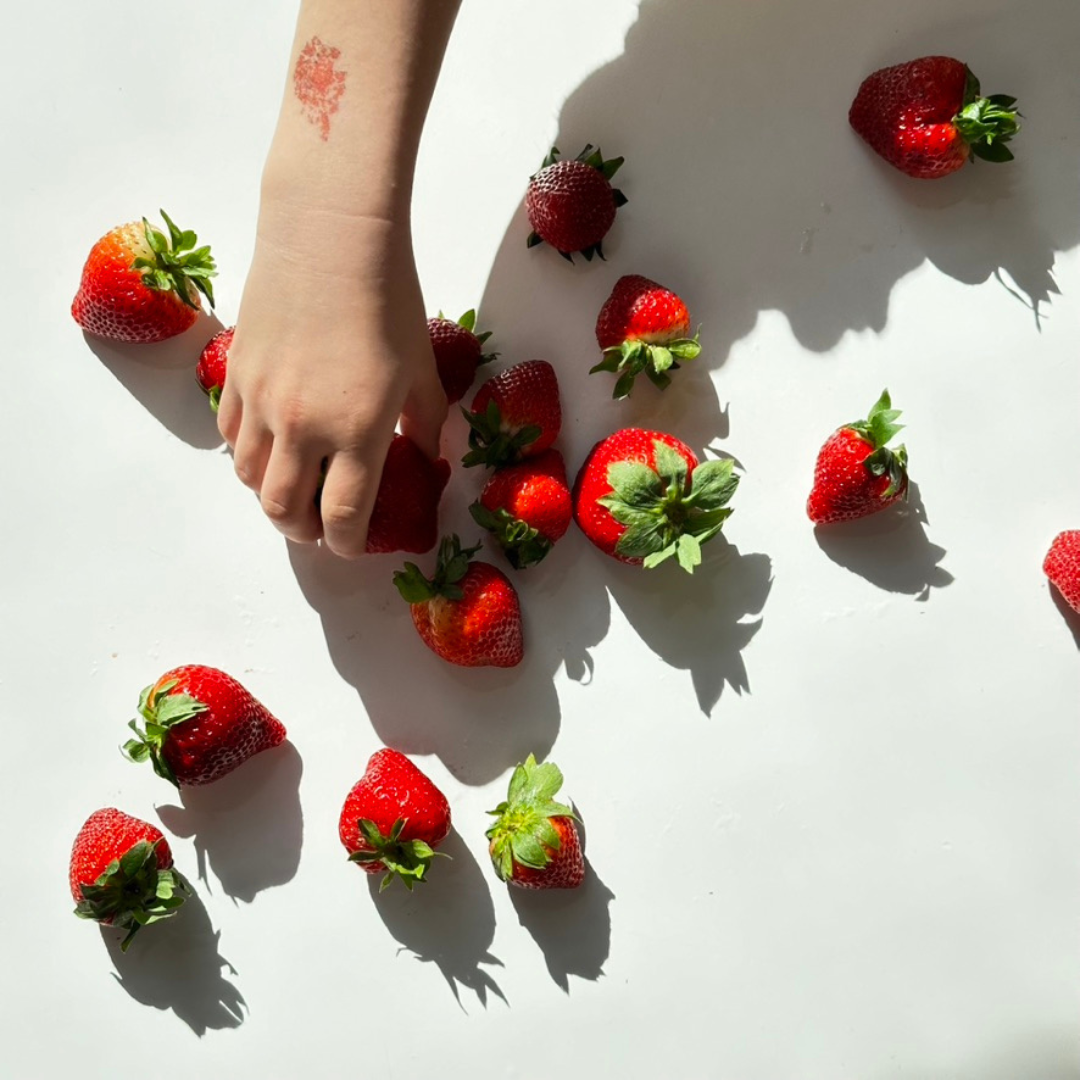 Kids Hand and strawberries