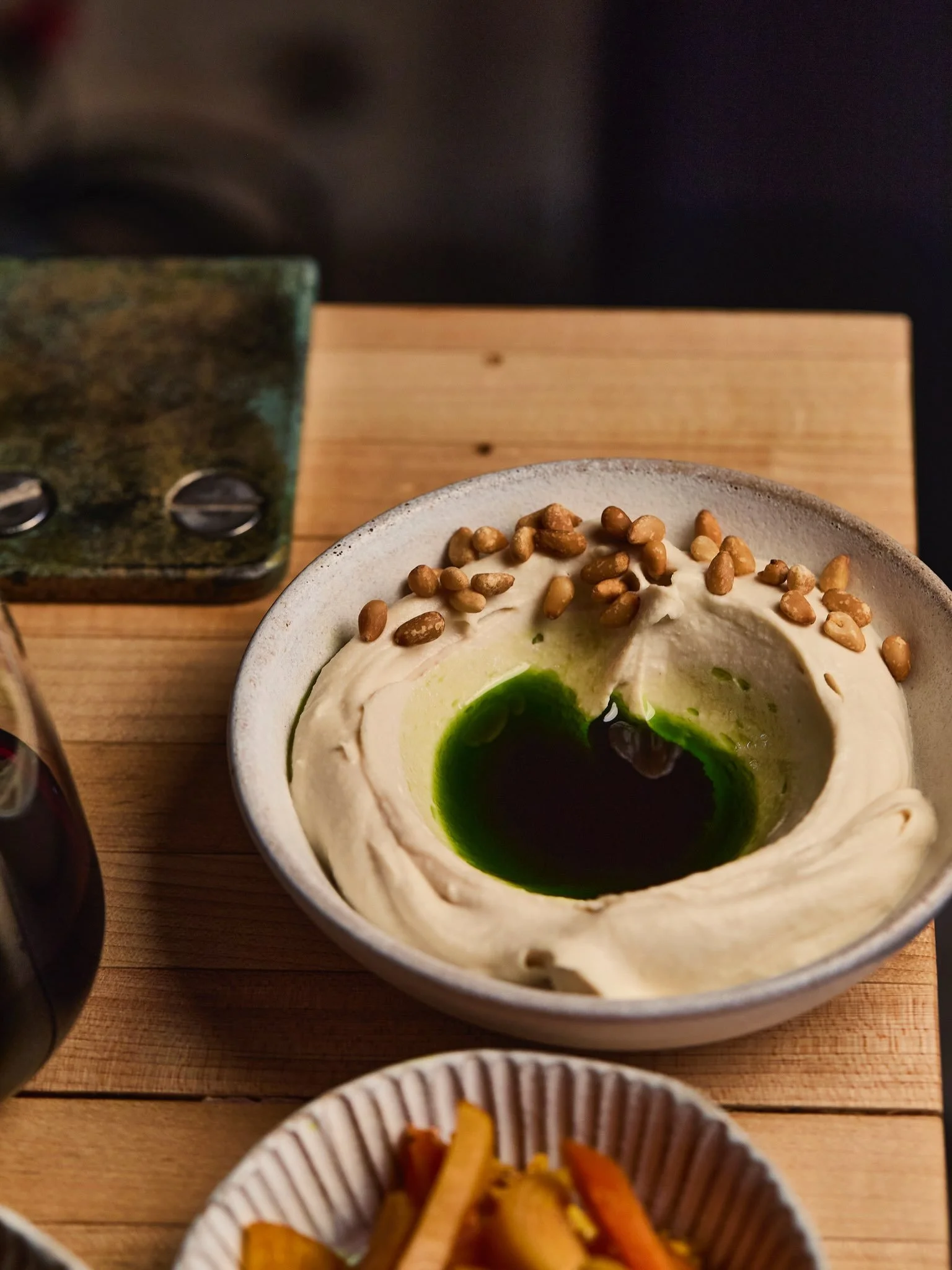 PALM GREENS HUMMUS 

Made with butter beans, confit garlic, Lebanese tahini, finished with herb oil &amp; pine nut. 

This is no ordinary bowl of hummus. 

On the menu at Atmosfer, served with in house pickles. 

Next date 23 October, feasting menu a