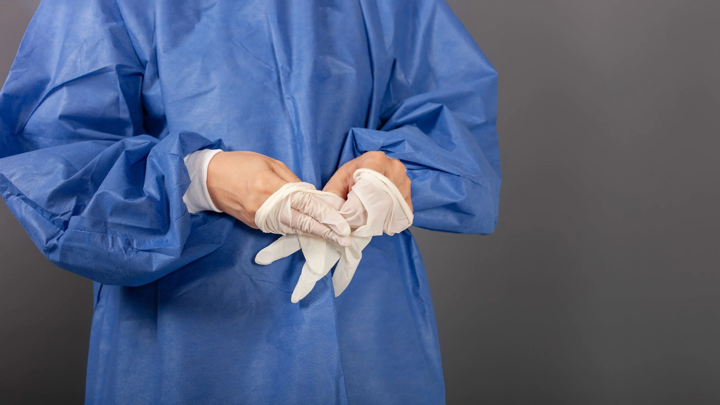 close-up-doctor-taking-off-white-gloves.jpg