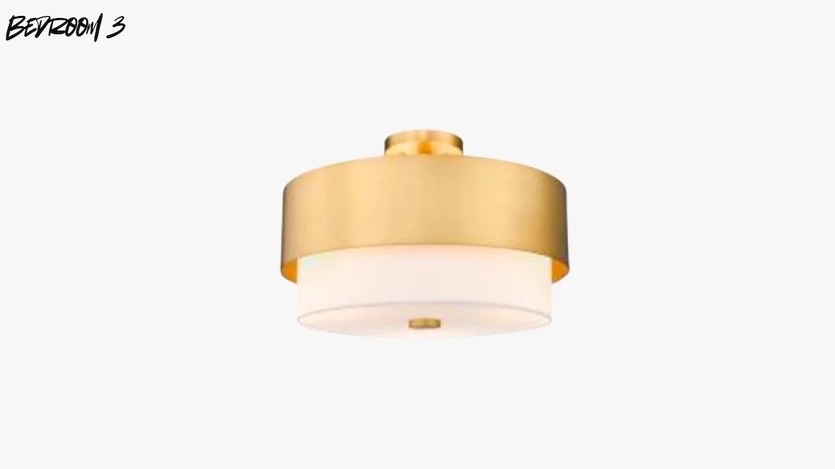 A ceiling light fixture with a gold-colored metal outer ring and a white frosted glass diffuser.
