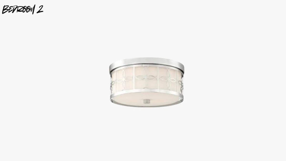 Ceiling light fixture with a round, modern design and decorative metal accents, installed in a plain ceiling.