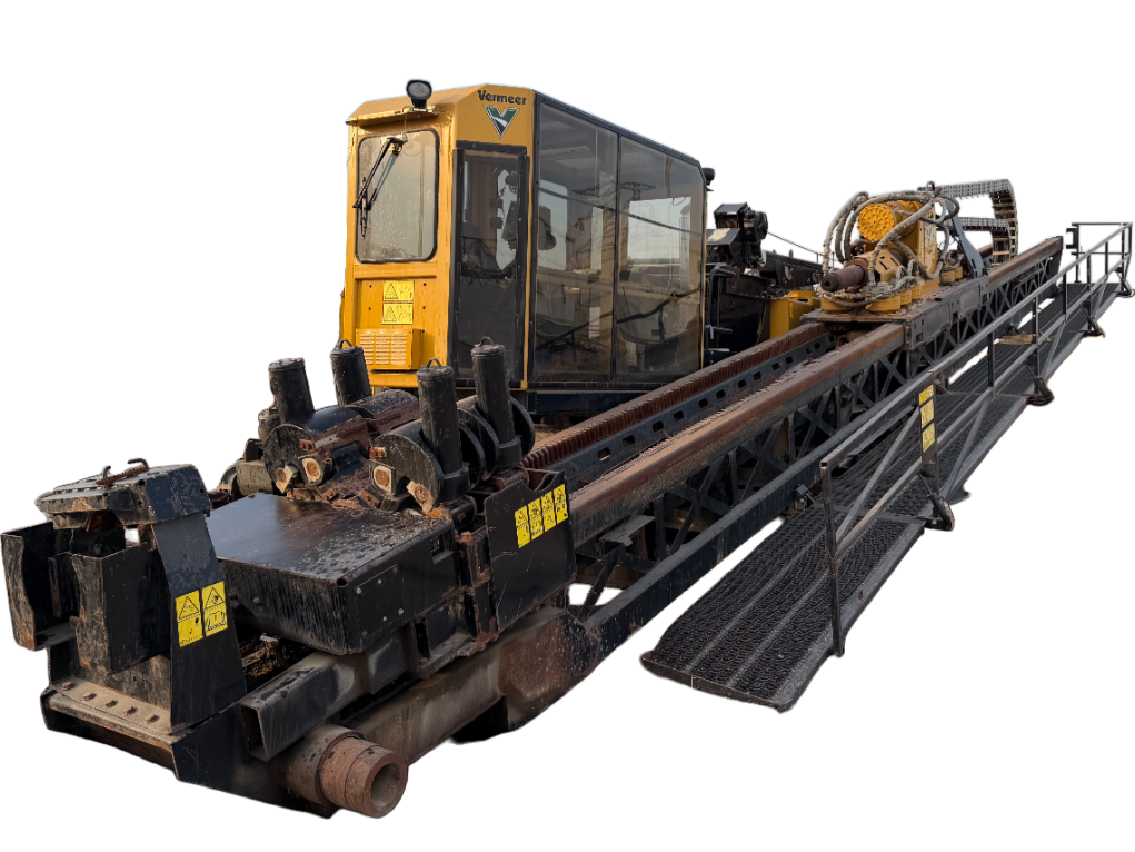 A large industrial rail guide vehicle with a yellow cabin, black metal framework, and machinery on the track.