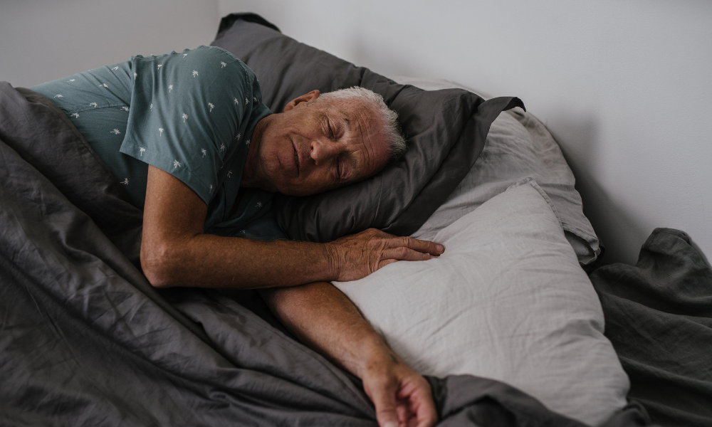 man sleeping on a bed